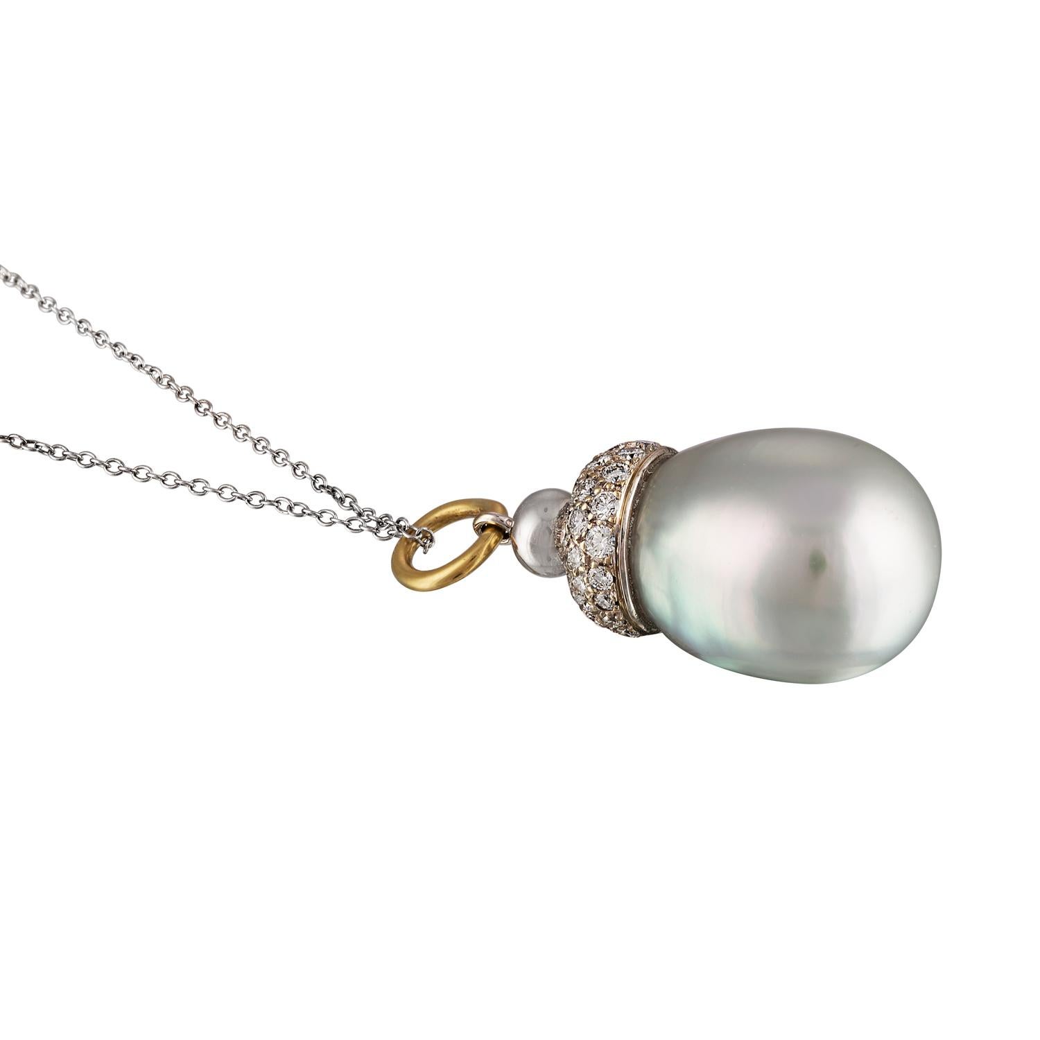 This pendant features an oversize South Sea white baroque cultured pearl measure 16.3mm with a diamond pave cap consisting of 65 diamonds set in 14 karat white gold.
The South Sea pearl has excellent luster with strong silver/blue overtones.  
This