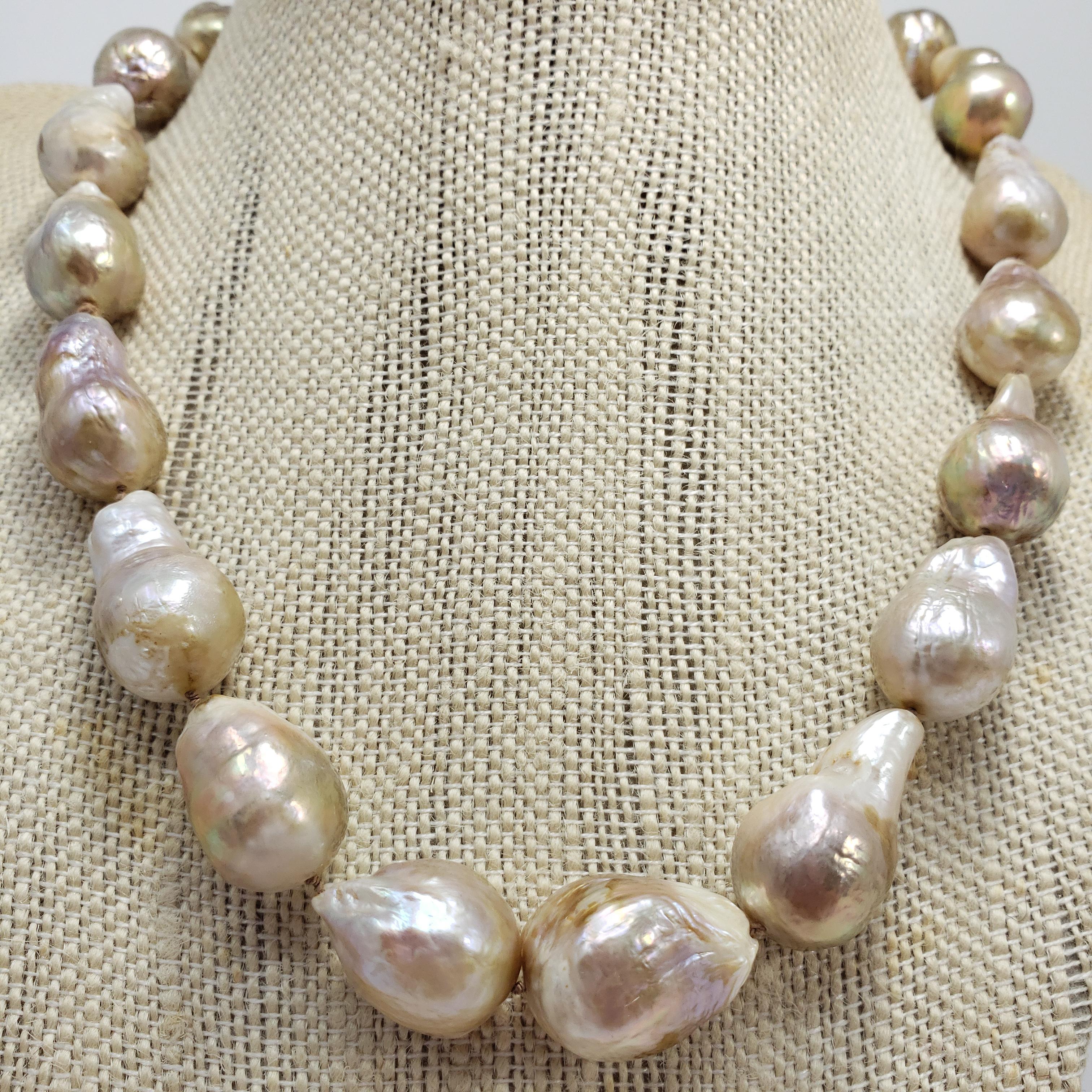 An exquisite strand of South Sea baroque pearls on a sterling silver S-hook clasp. Gorgeous color gradient! A classy necklace perfect for any style.

Each pearl approximately 2.1 cm x 1.35 cm
Hallmarks: 925