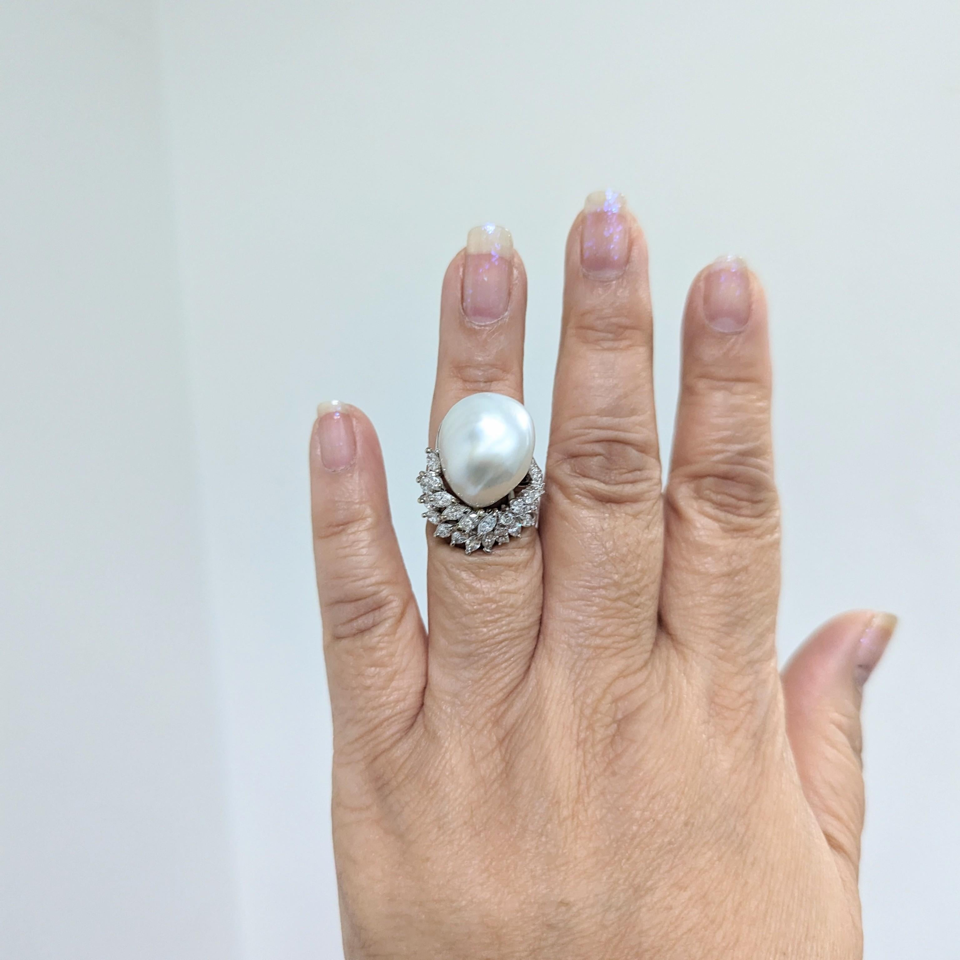 Beautiful large white South Sea baroque pearl with 1.50 ct. white diamond rounds and marquise shapes.  Handmade in platinum.  Ring size 6.