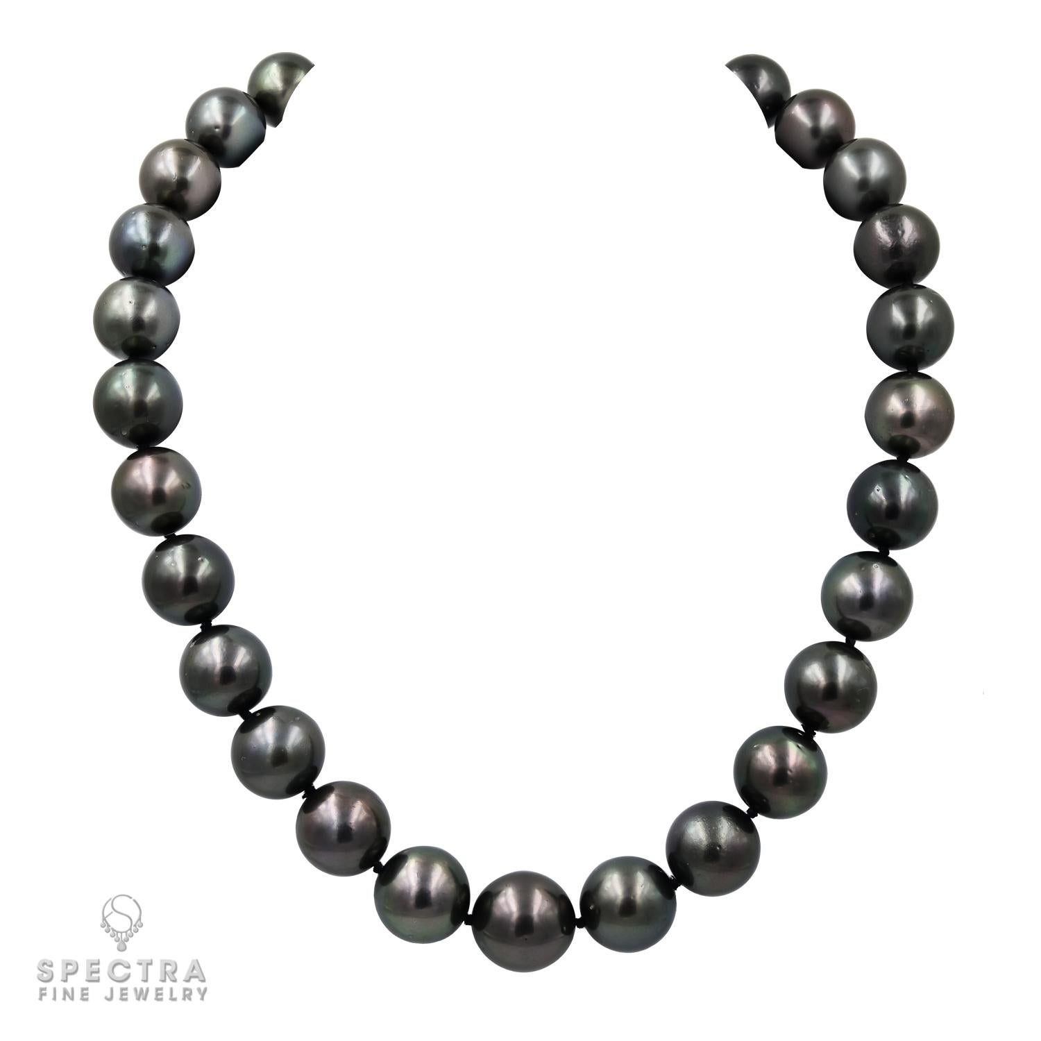 Elevate your style with this exquisite single strand South Sea black pearl necklace, adorned with a captivating green overtone. Crafted from 29 natural South Sea cultured pearls, each pearl boasts a diameter ranging from 15 to 17.65mm, ensuring a