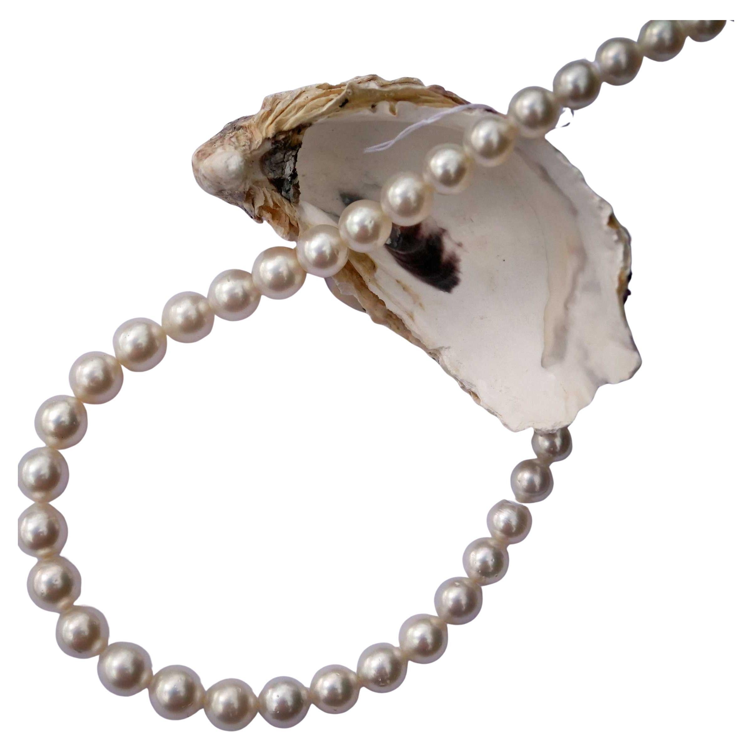 Fili di perle coltivate del MARE DEL SUD bianche AAA+ VERY FINE Luster rotonde 11,9 x 9,0 mm in vendita