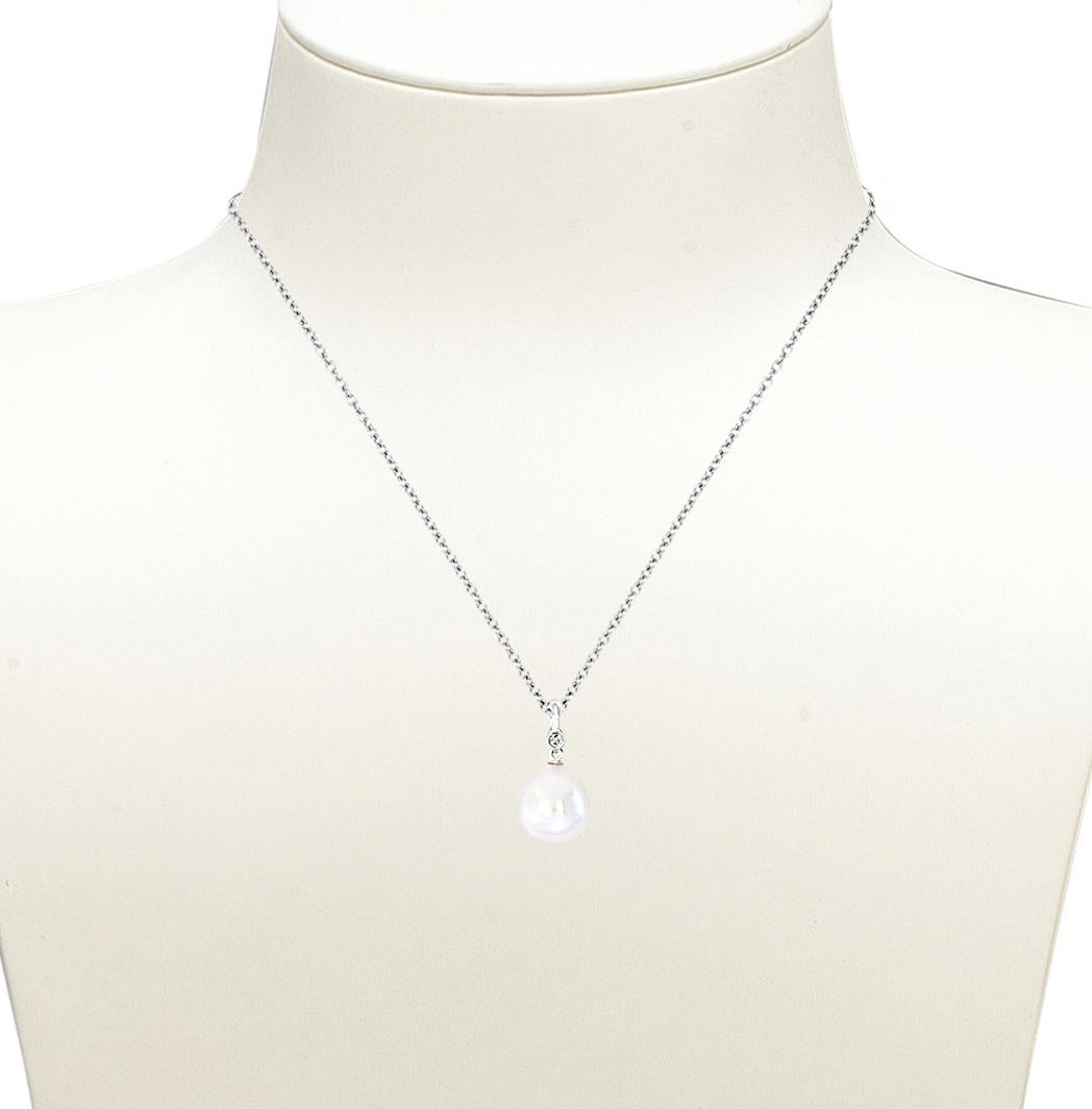This 14k White Gold pendant features a South Sea White drop-shaped cultured pearl measuring 11-12mm in width. The pearl is set on a 14K white pendant with 0.03 total carats of diamonds. The pendant hangs from an adjustable length 14k white gold