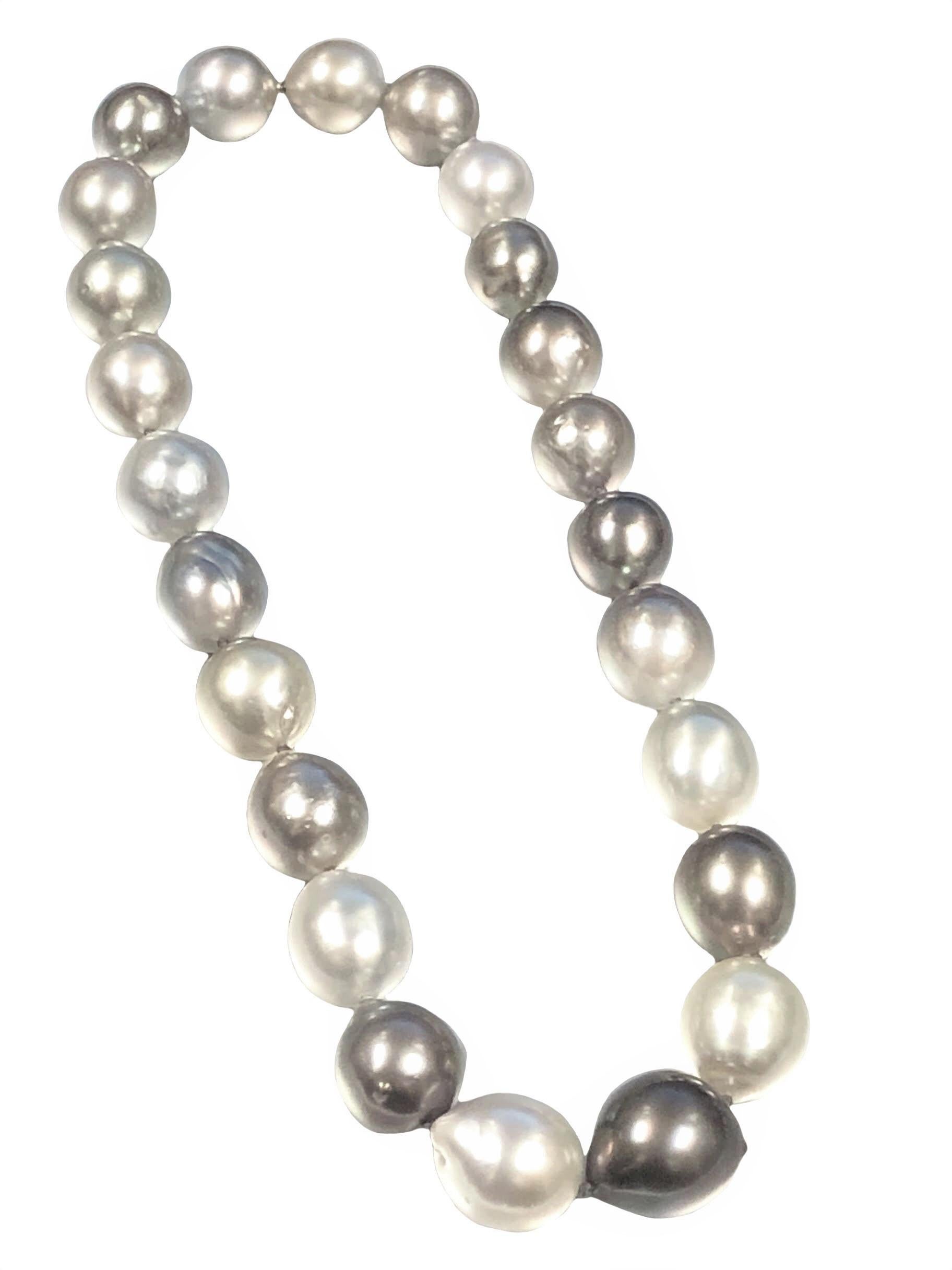 A 32 Inch Strand of Tahitian South Sea Pearls that breaks down into either a 17 1/2 and a 14 1/2 strand, comprised of Light Gray to a darker Charcoal Gray the pears measure in size from 14 X 12 to 17 X 16, having hidden threaded clasps, these all