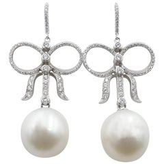 South Sea Large 18 Carat White Gold Pearl and Diamond Bow Drop Earrings