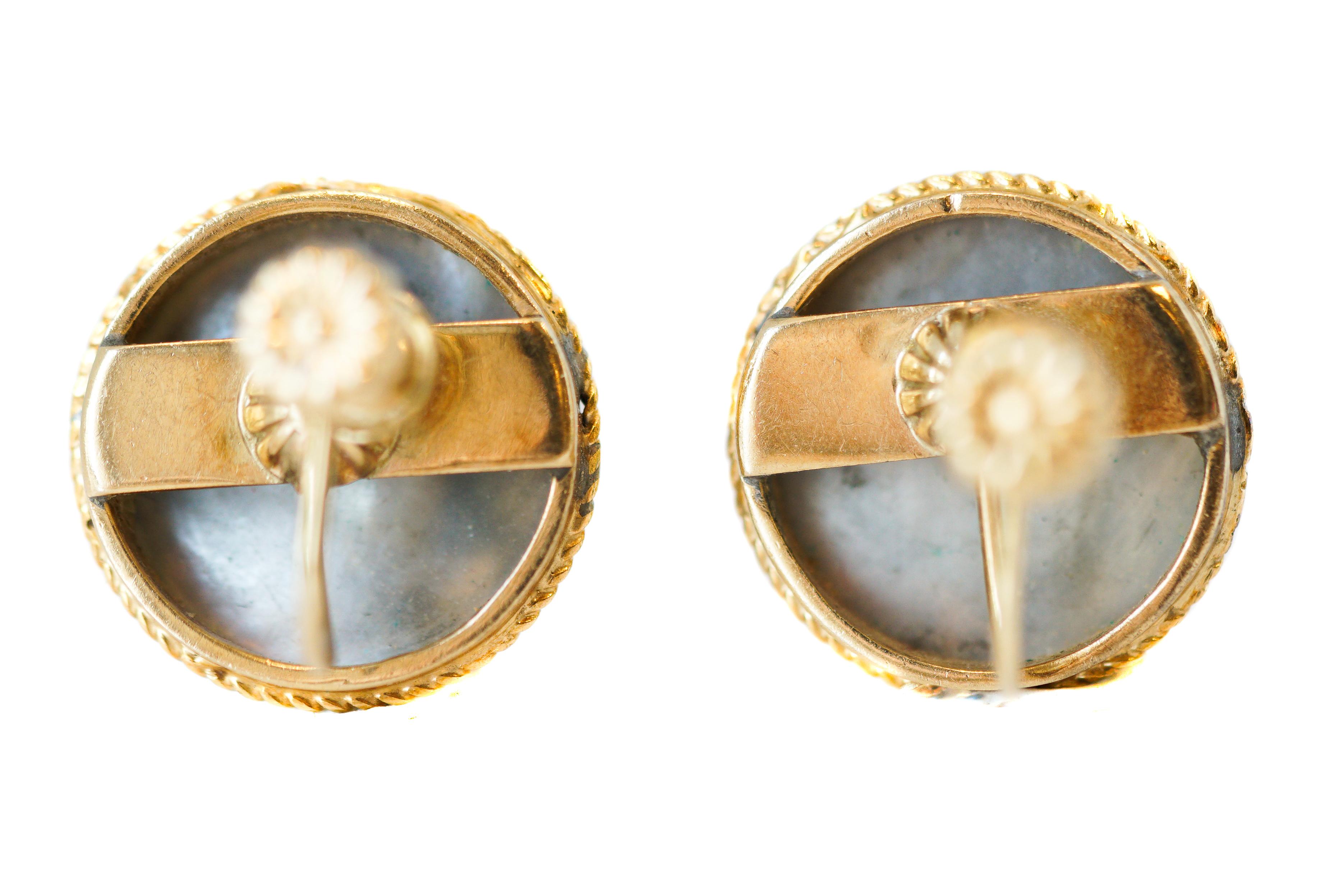 1950s Retro Pearl Clip On Earrings - 14 Karat Yellow Gold, South Sea Mabe Pearls

Features:
Screw Back Clip On design for Non Pierced Ears
14 Karat Yellow Gold Frames and Backs
Lustrous Grey Pearls with Fantastic Pink, Blue, Purple and Green Color