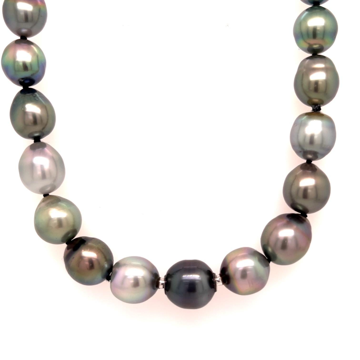 A South Sea multi black pearl necklace, 9mm- 11mm baroque, cultured from Tahiti with 18k white gold modullyn parts, with a An 18k white gold ball clasp set with .393 carats of white F color VS clarity diamonds, and .339 carats of aqua blue diamonds.