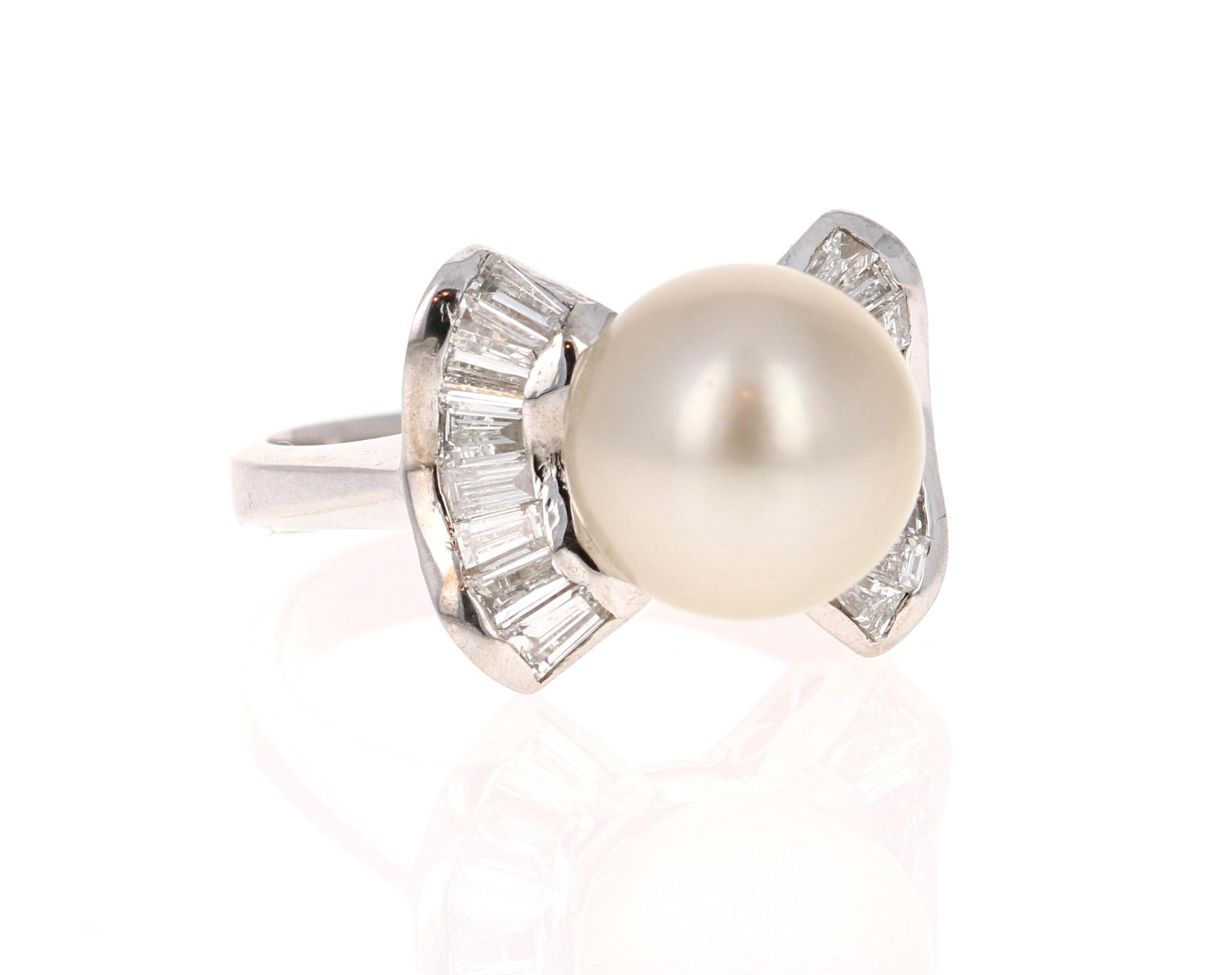 This beautiful ring has a stunning 10 mm South Sea Pearl that is set in the center of the ring.  The pearl is surrounded by a cluster of 18 Baguette Cut Diamonds that weigh 0.75 carats (Clarity: VS and Color: F) 
The ring is made in 14K White Gold