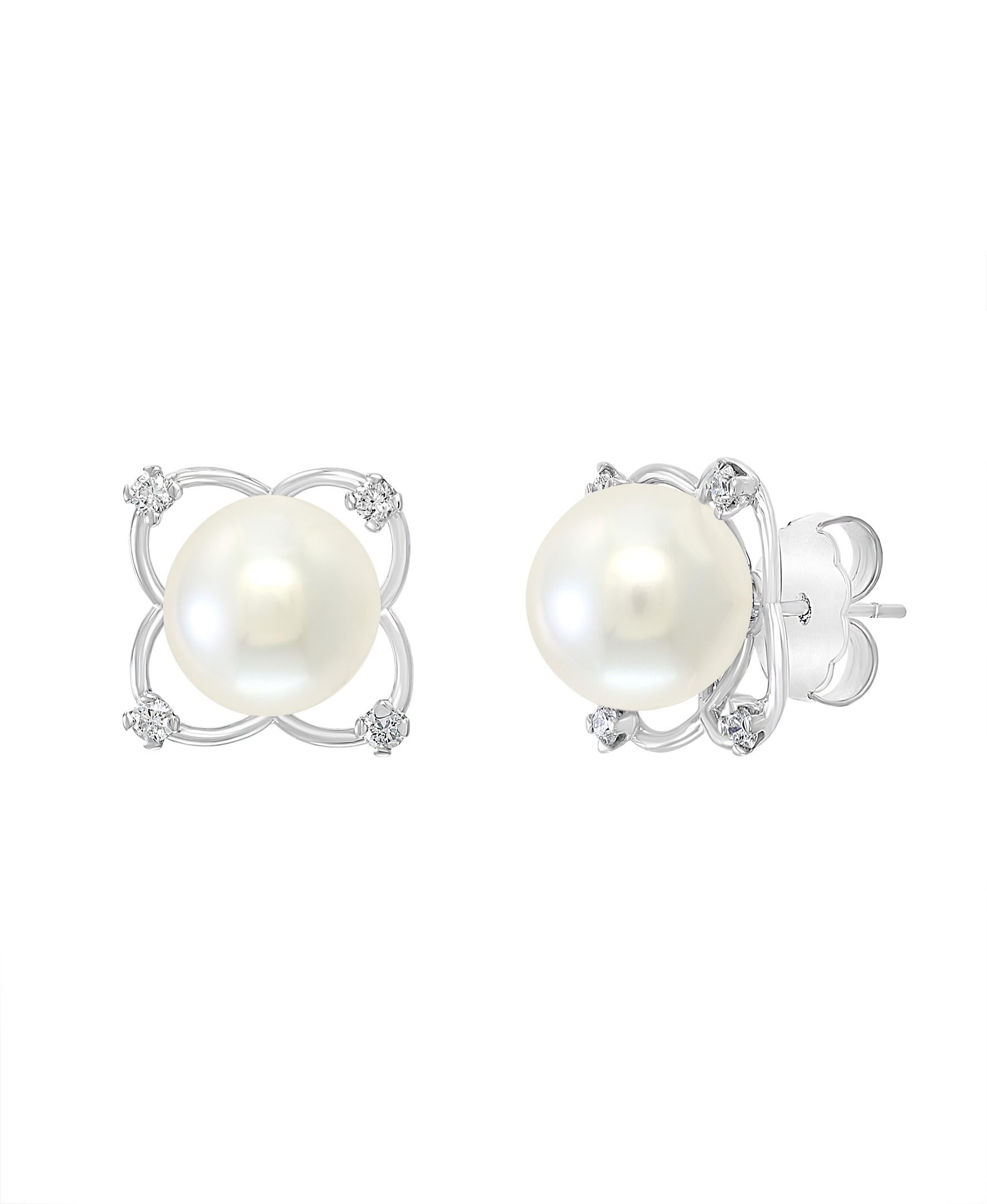 These elegant Diamond and Pearl earrings contain South Sea white round cultured pearls gracefully encased in white gold and diamonds. The floral design creates a striking enclosure for these lustrous pearls.
- 14K White Gold
- 0.40 carats of