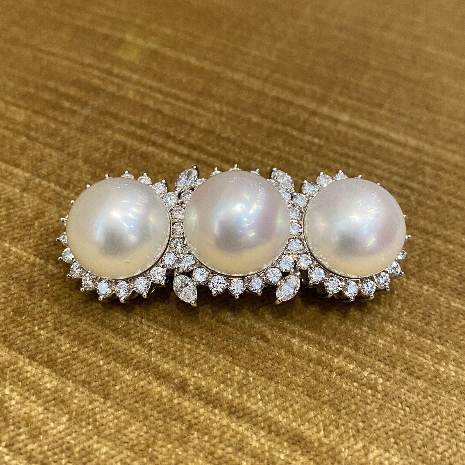 South Sea Pearl and Diamond Bar Brooch Pin in Platinum

Triple Pearl and Diamond Pin features three white South Sea Pearls, each 14.5mm in size with minor blemishes, surrounded by Round Brilliant Diamonds and Marquise Diamond accents set in