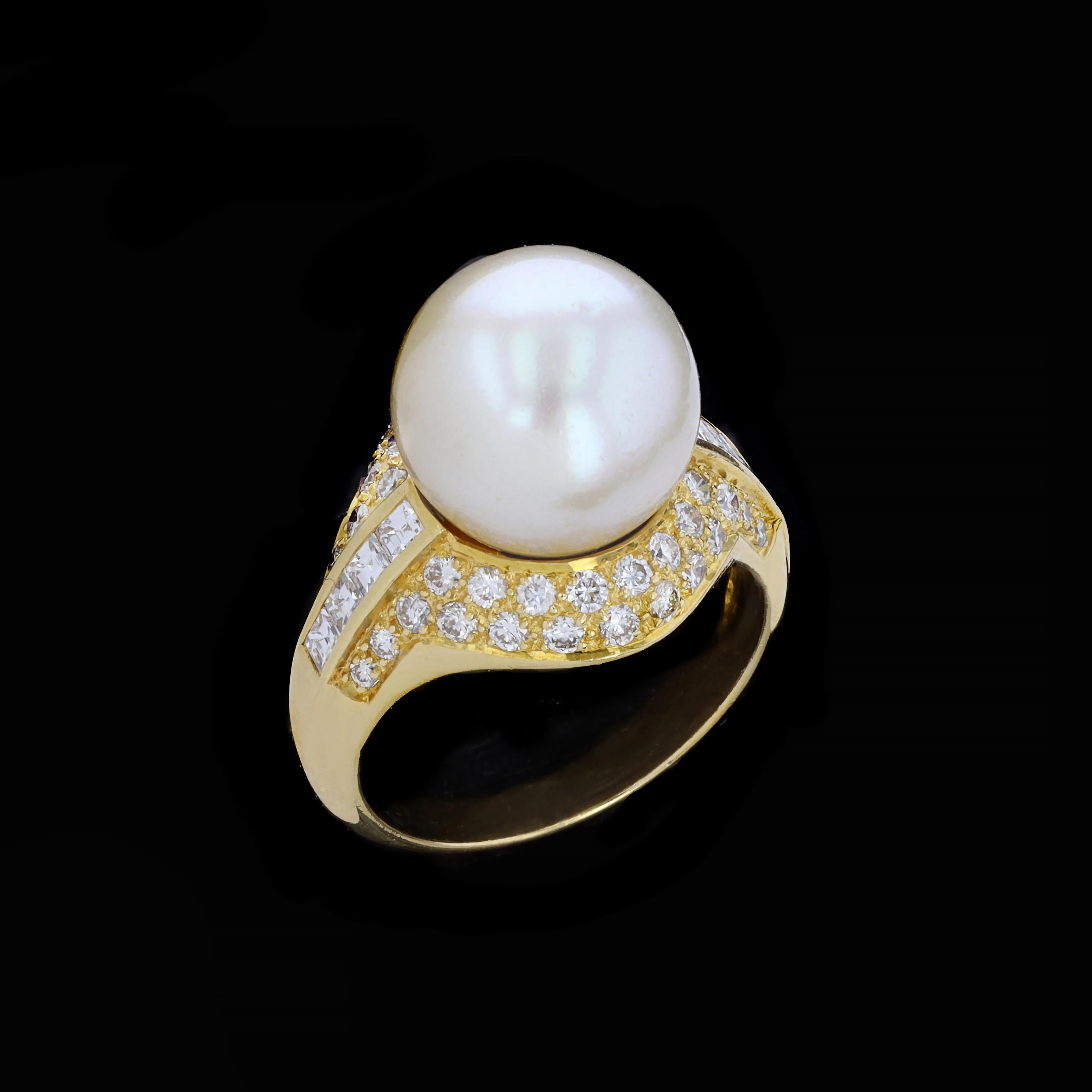This striking 18K yellow gold South Sea pearl and diamond cocktail ring is full of glitz and glamour. Breathtakingly bold, this cocktail ring has a 11.50 mm round South Sea pearl and 50 diamonds 1.25twt. Size 6