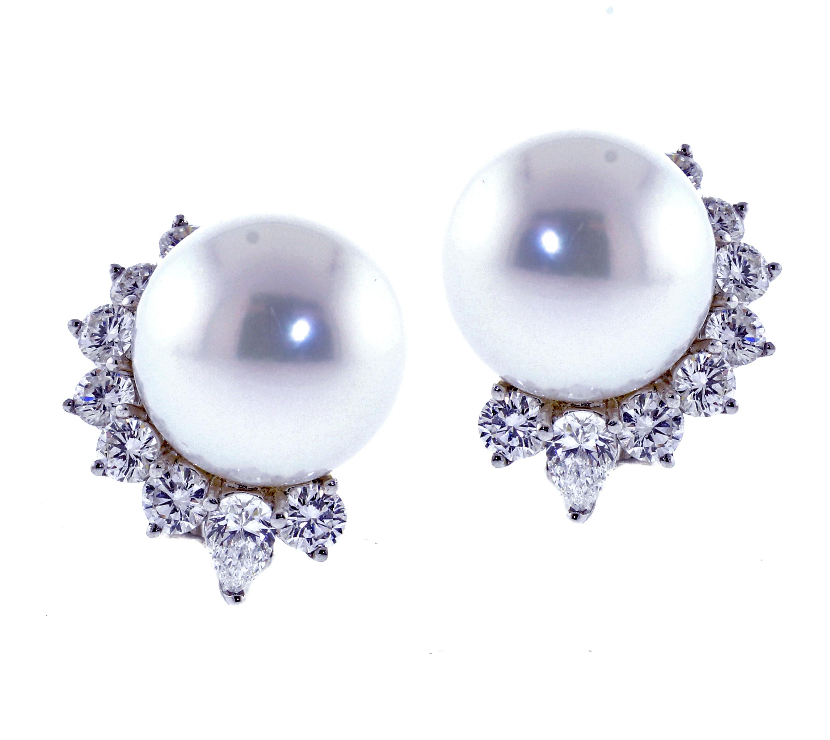 1From Pampillonia Jewelers, a stunning pair os south pearl and diamond earrings. The south sea pearls measure  13.5-14mmr. The earring feature 12 round diamonds weighing 2.00cts and 2 pear shapes diamonds weighing .51cts. Set in 18 karat white gold.