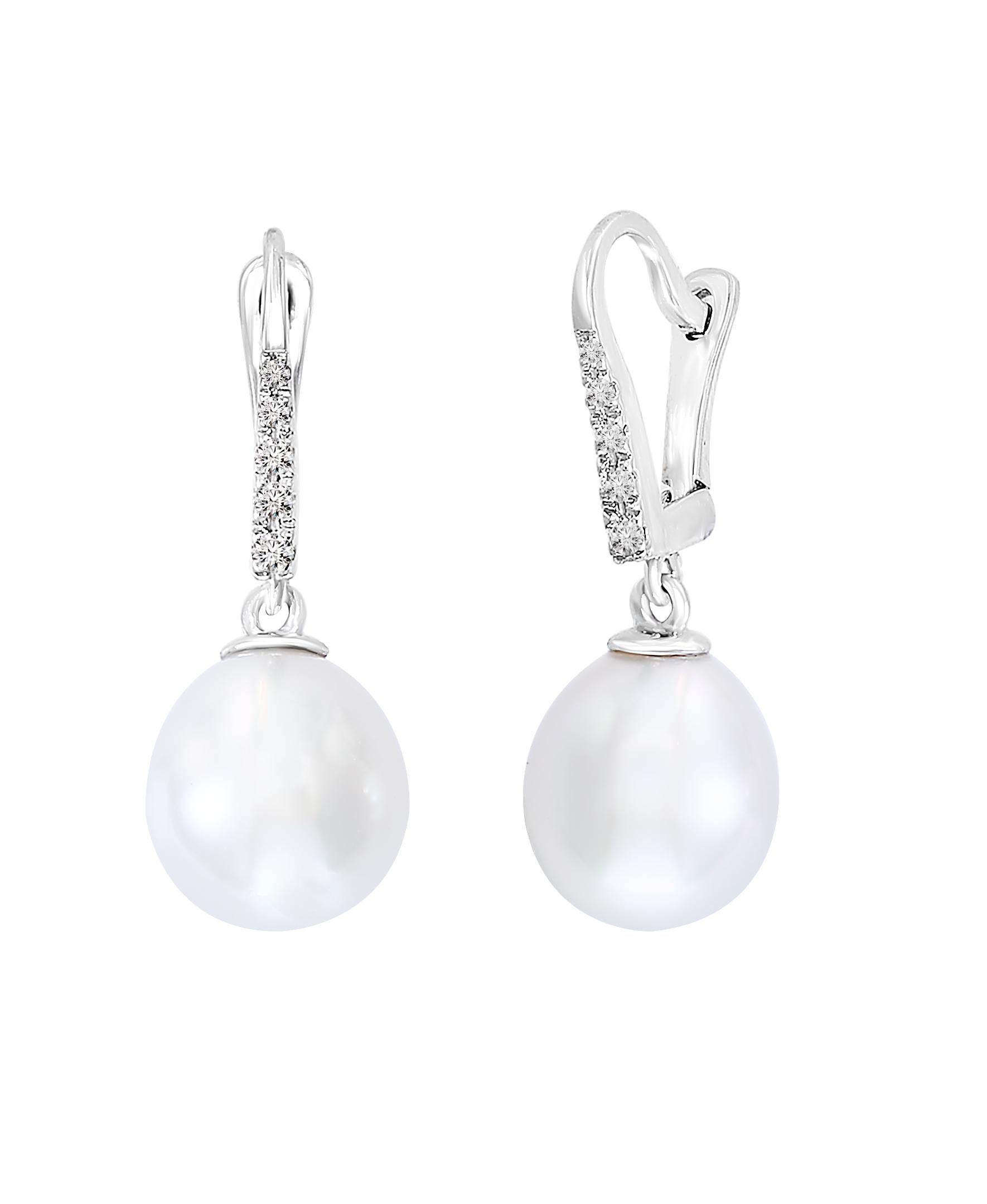 These dangle earrings feature South Sea drop-shaped pearls measuring 9-10mm in width. The earrings are made of 14k white gold with  .085 total carats of diamonds. 
Great for everyday wear or a dressy occasion, these earrings are a must-have for any