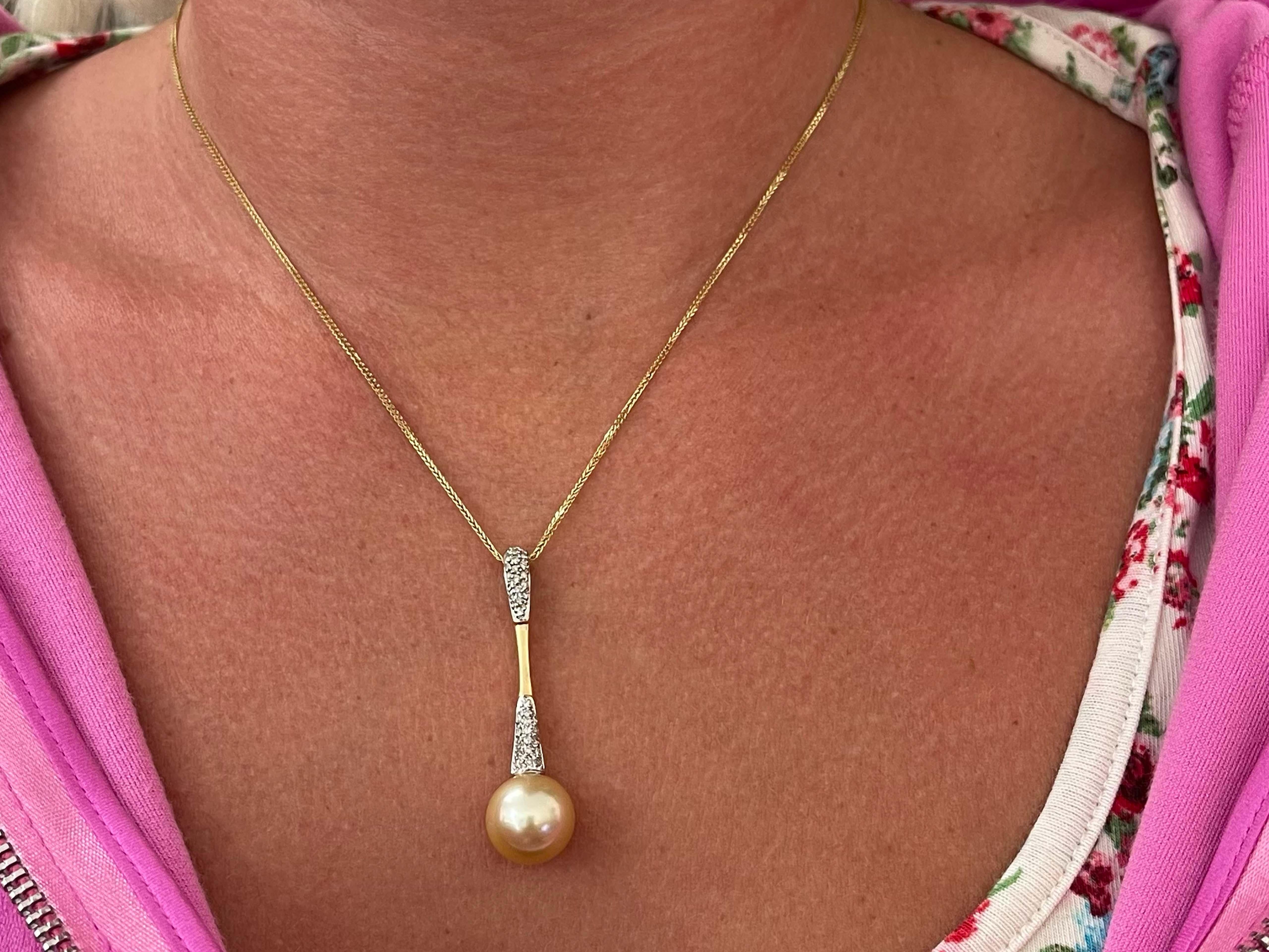 Create a touch of magic wearing this lovely south sea pearl drop necklace with diamonds. The 37 diamonds weigh 0.15 carats and are G-I color and SI clarity. The pendant drops 1.75