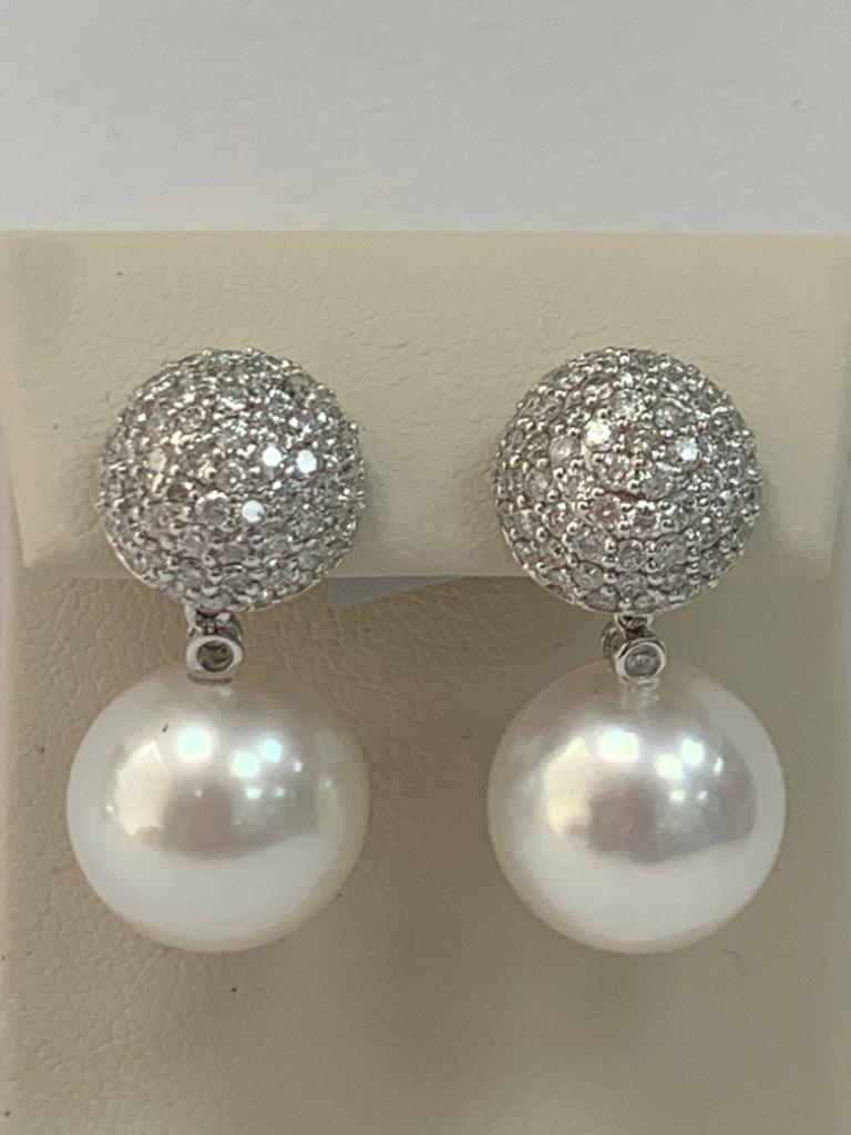 Metal; 18k white Gold
Pearl Size: 12-13mm White Gold
Pearl quality: AAA
Pearl Luster: AAA Excellent
Nature: South Sea Cultured Pearl
Nacre : Very Thick
Diamond Weight; 2.30 Cts.
Diamond Color: G+
