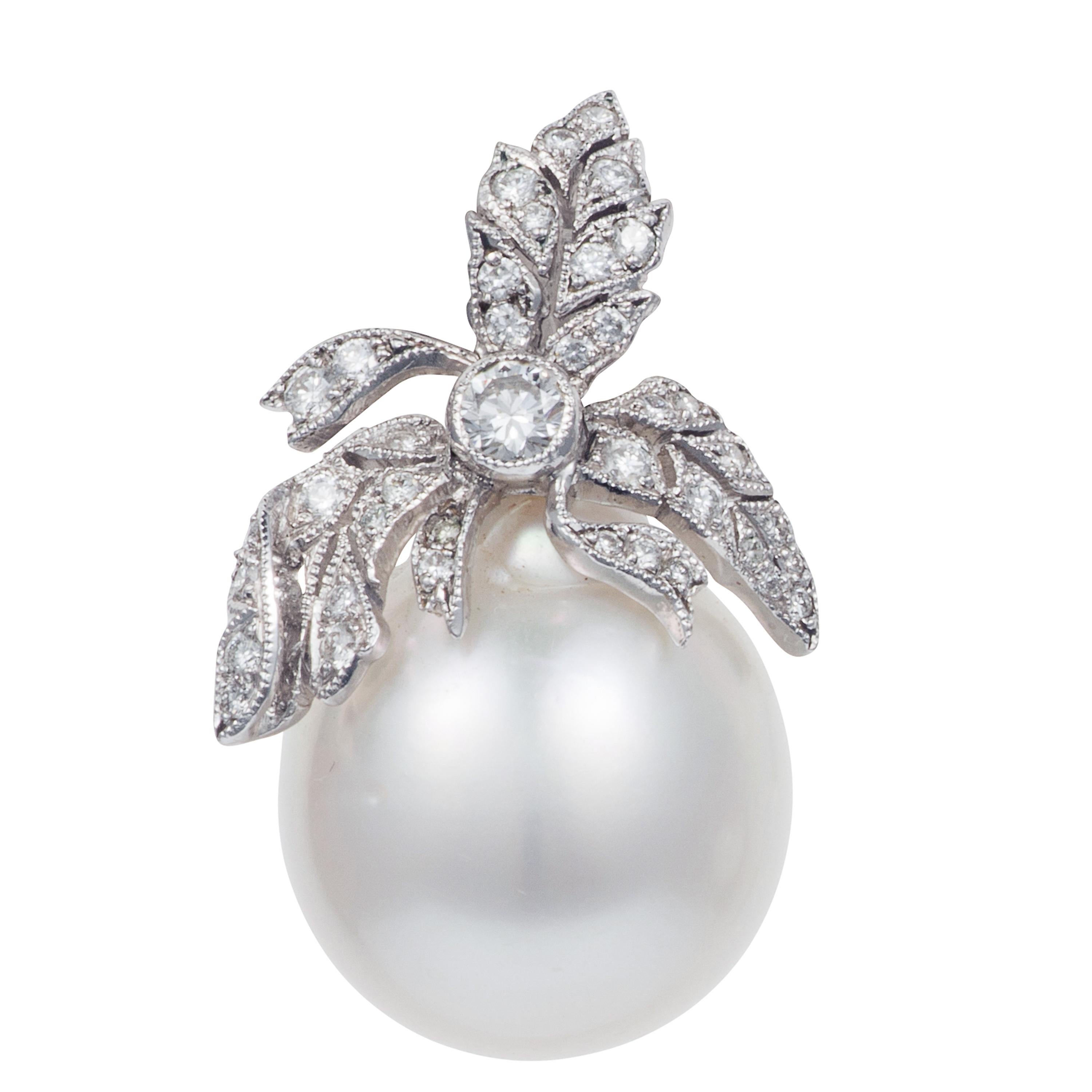 Luminous natural South Sea Pearls are set against diamond encrusted leaf motifs in these elegant eye-catching earrings.  The detail within each diamond leaf motif is an artwork in itself and sits in perfect proportion on top of each stunning pearl. 