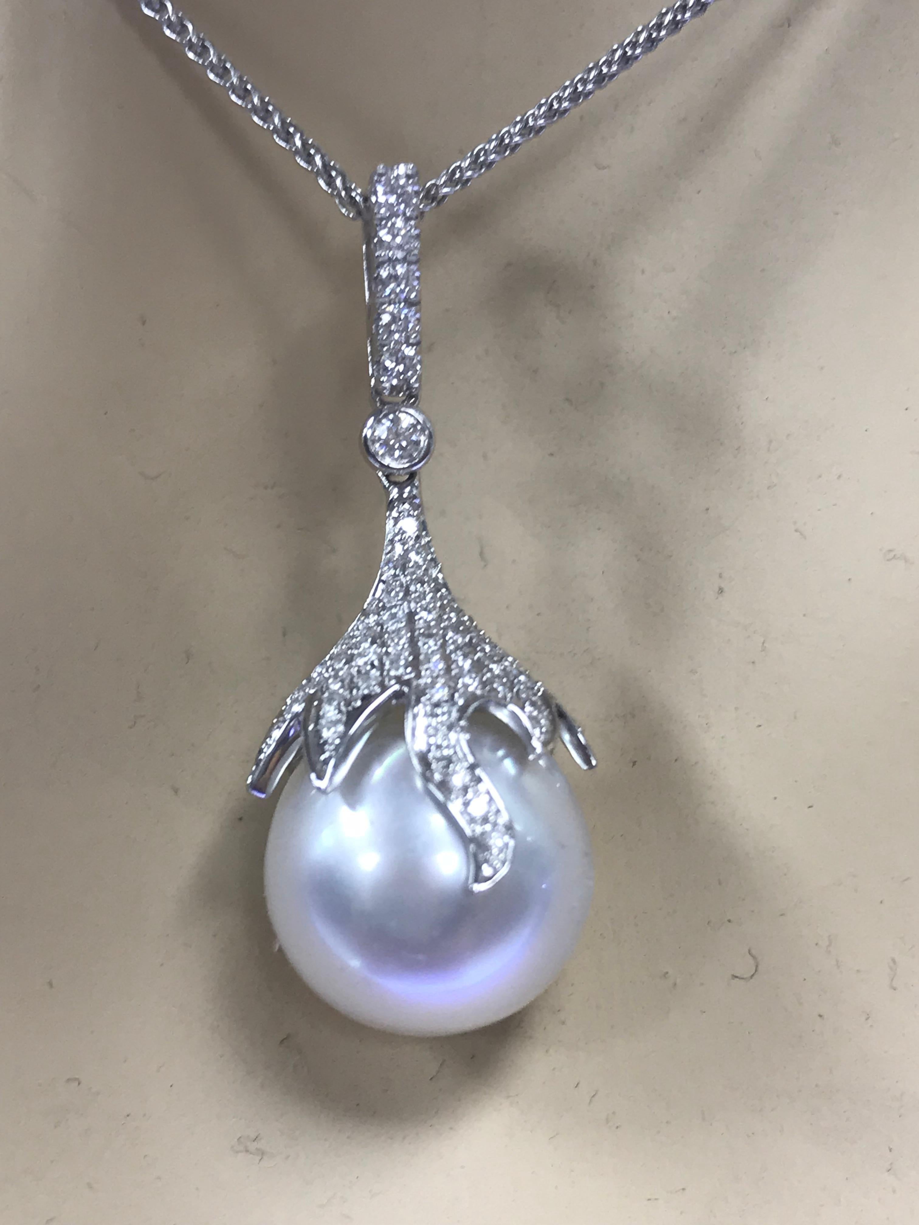 Nature	South Sea Cultured Pearl
Pearl Quality	AAA
Luster	AAA, Excellent
Nacre	Very Thick
Jewelry Style	Pendant
Metal Purity	18K
Metal Type	White Gold
Stone Shape 1	Round
Stone Count 1	57
Stone Weight 1	0.32 ct.
Stone Color 1	G+