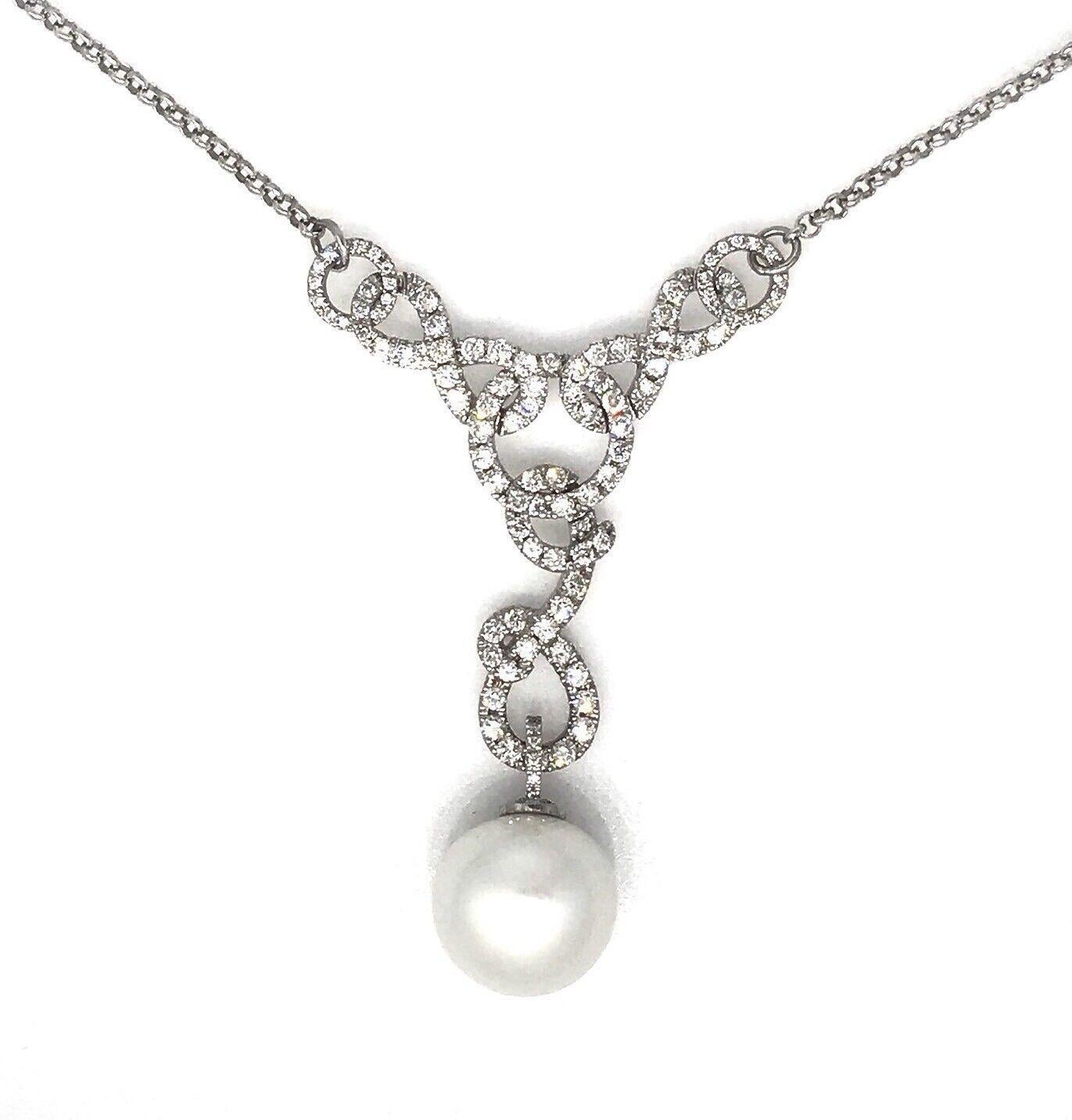 Diamond and South Sea Pearl Necklace Pendant in 18k White Gold

Diamond and Pearl Necklace features a White South Sea Pearl, 16mm in diameter, dangling from the bottom of a Swirled Diamond Pendant with Round Brilliant cut Diamonds Pavé set in 18k