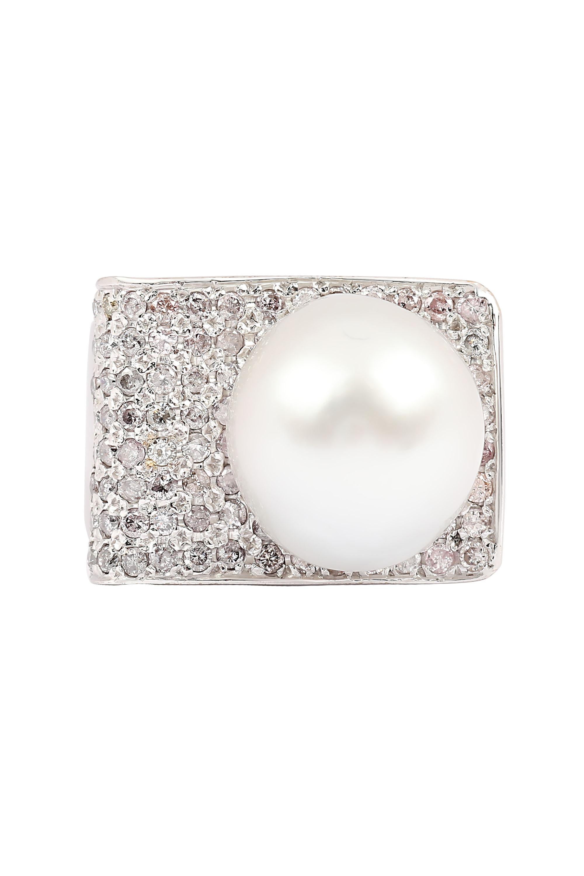 This modern and striking set features luxurious bright, cool white South Sea Pearls set amidst glittering fields of icy pave diamonds. The ring features a 13.8 mm South Sea Pearl set upon a ribbon of approximately .70 carats of round pave diamonds.