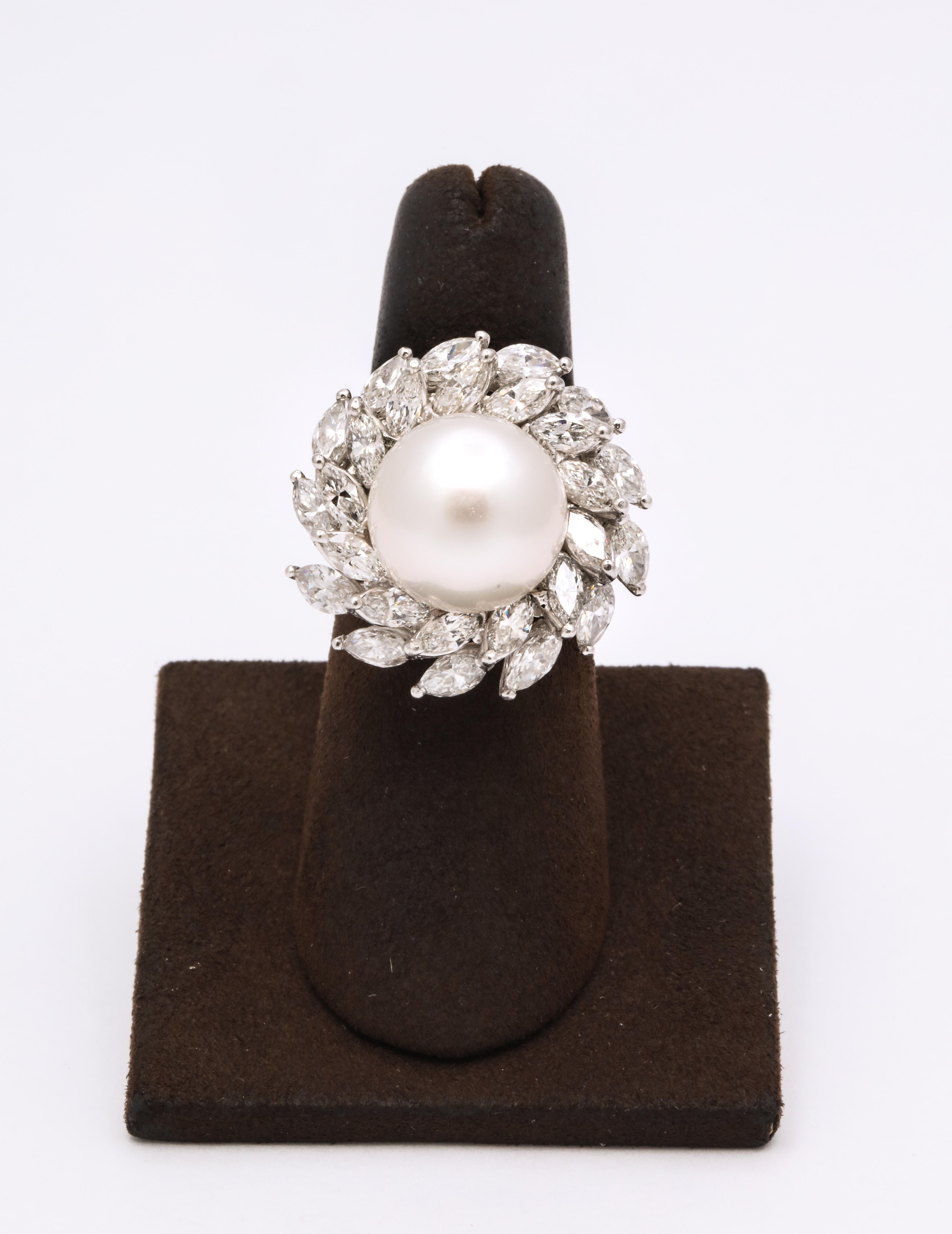 A stunning pearl surrounded by two rows of fabulous white marquise diamonds.

Approximately 13 mm south sea pearl 

6.12 carats of marquise cut diamonds

set in Platinum 

This beautiful ring is currently a size 6.25 but can be sized to any finger