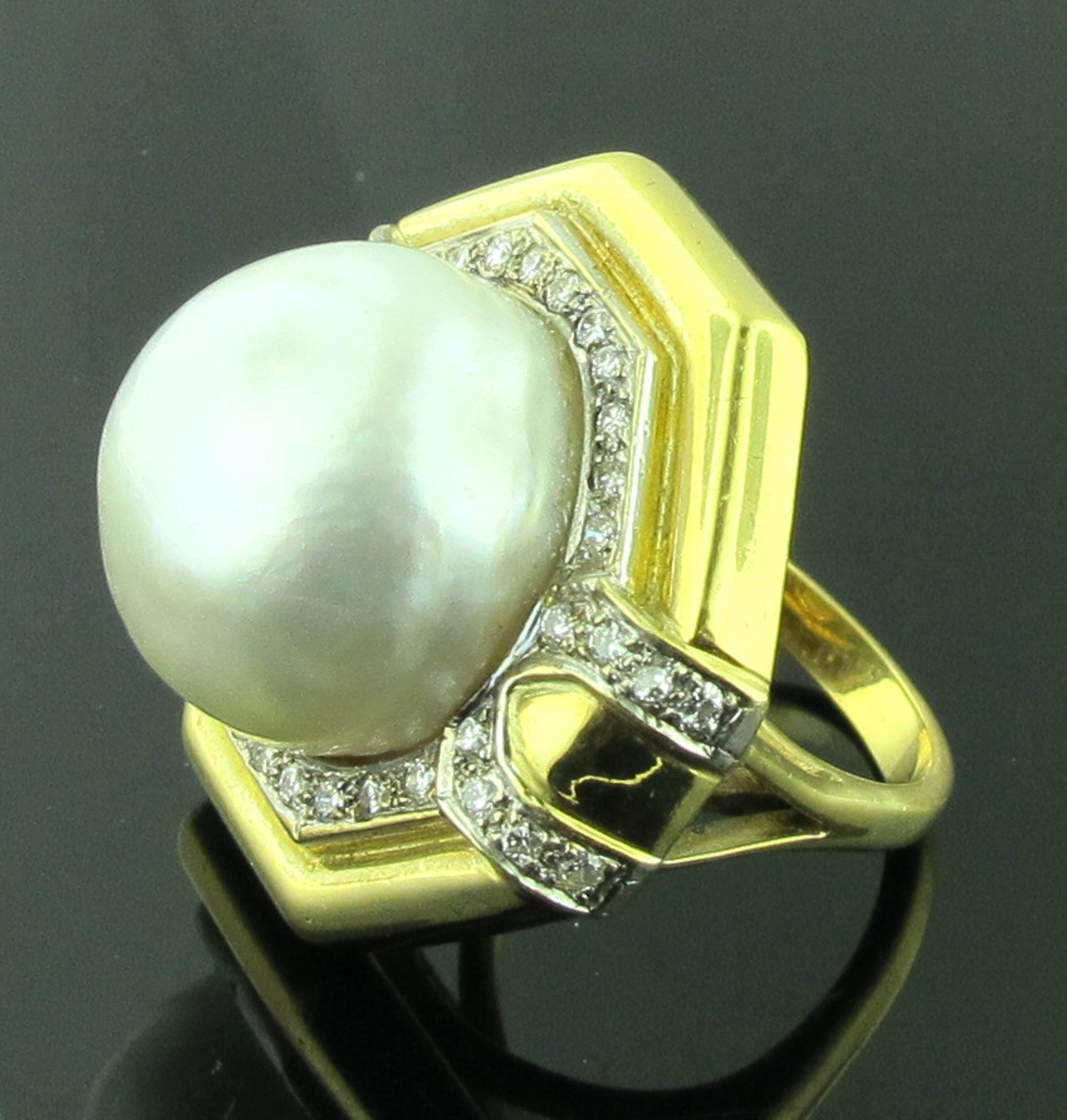 Set in 18 karat yellow gold is a 16 millimeter white South Sea Pearl surrounded by 36 round brilliant cut diamonds with a total diamond weight of 0.75 carats.  Color is I, Clarity is SI.  Ring size is 6.75.