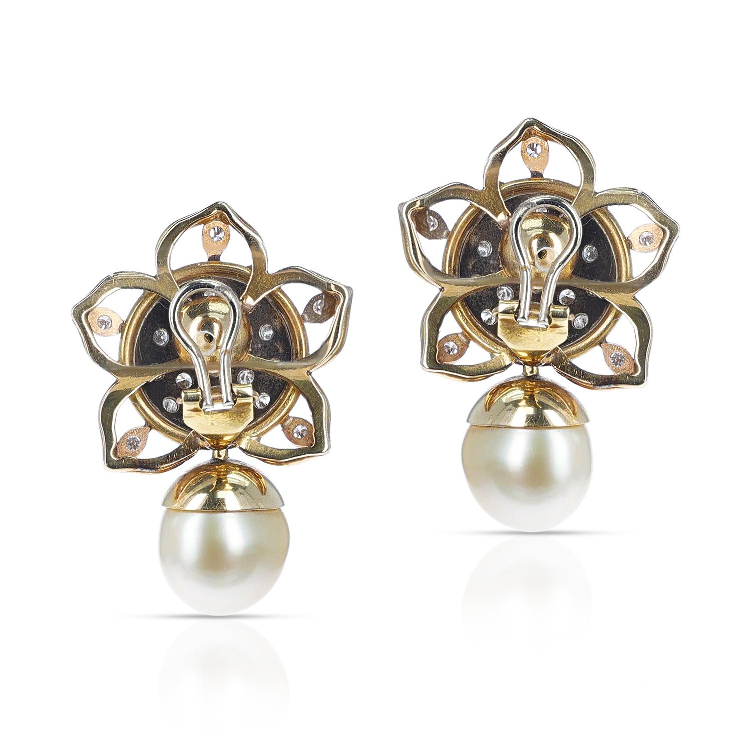 A pair of Pearl and Diamond Earrings. The earrings are clip-ons. Post can be added on, if preferred. The total weight of the earrings is 28.90 grams. The total length is 1.50 inches. 