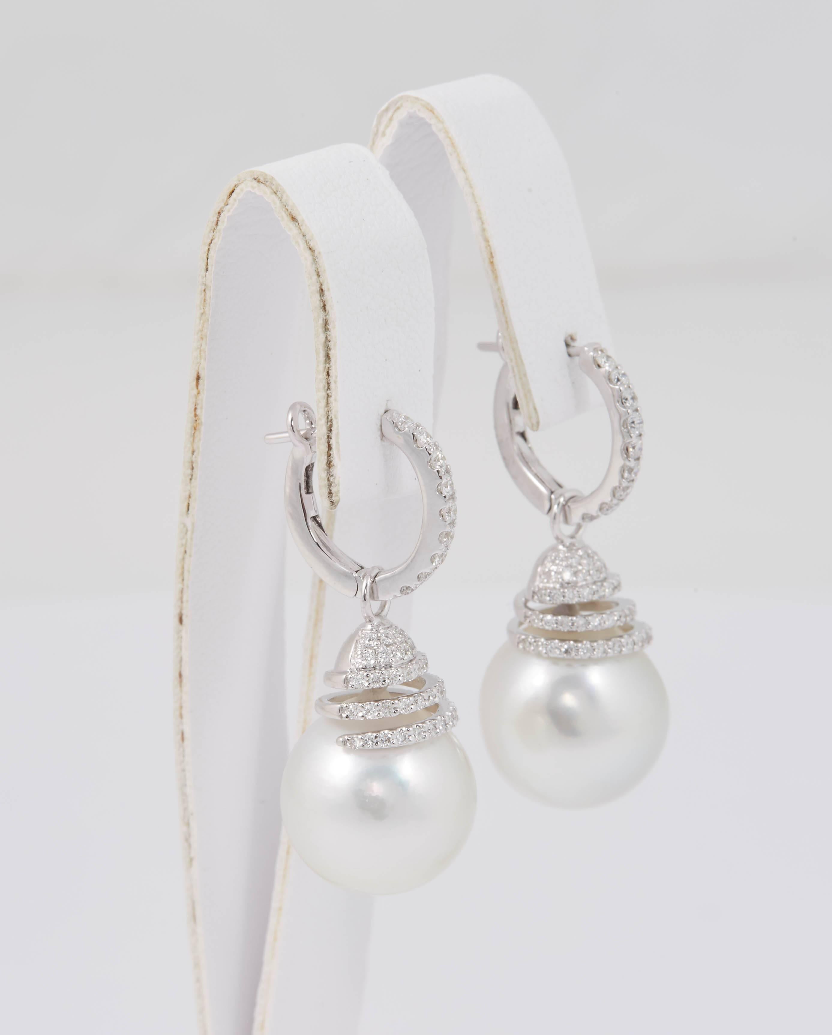 South Sea Pearls 13-14mm
Diamonds 0.70 Carats
18K white gold
The top part separates from the bottom to be able to wear them alone.