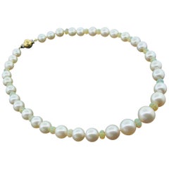 Collana di perle dei mari del sud e opale di fuoco