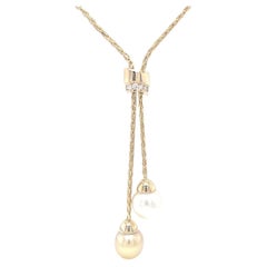 Südseeperlen- und goldene Südseeperlen-Südsee-Lariat-Halskette auf Gelbgoldkette
