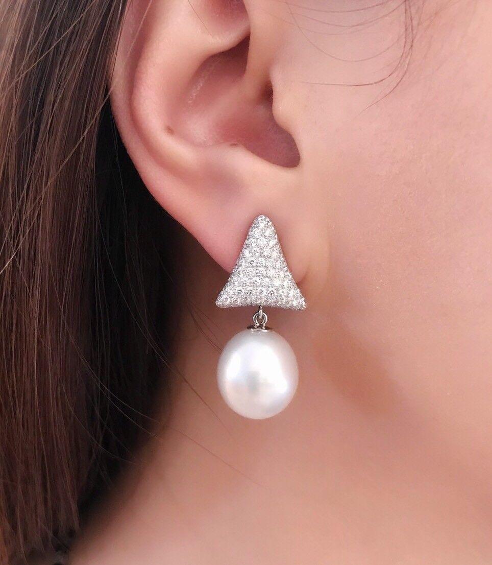 South Sea Pearl and Pave Diamond Dangle/Drop Earrings in 18k White Gold

South Sea Pearl and Diamond Dangle Earrings feature Triangular Pave Diamond Tops with 3.00 carats in total estimated of Pave-set Full-cut Round Diamonds and hanging below are