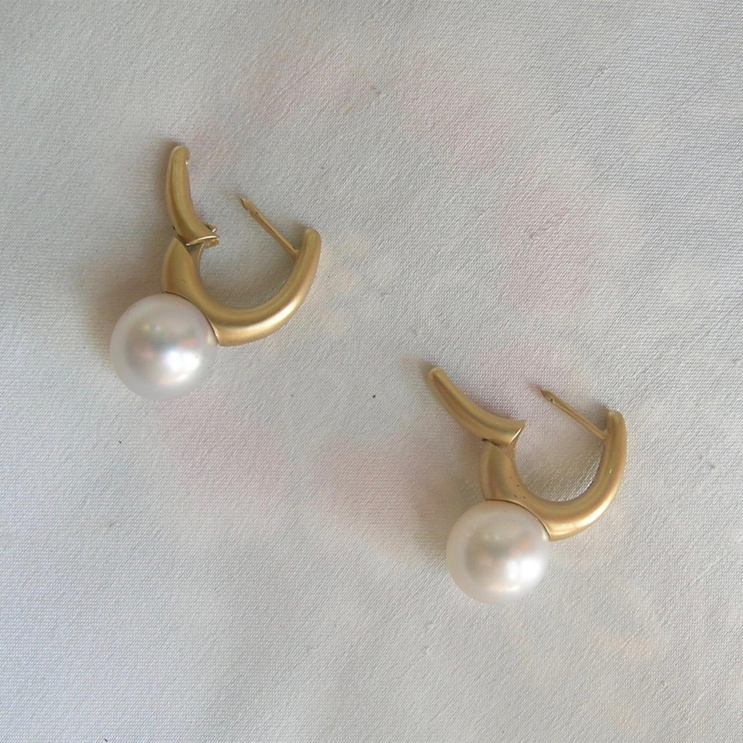 A simple, yet elegant pair of earrings.  Nancy designs light weight earrings and even for pearl earrings these are no exception.  The style can come in any pearl desired; south sea, tahitian, akoya or freshwater.  The satin gold makes a bold, but