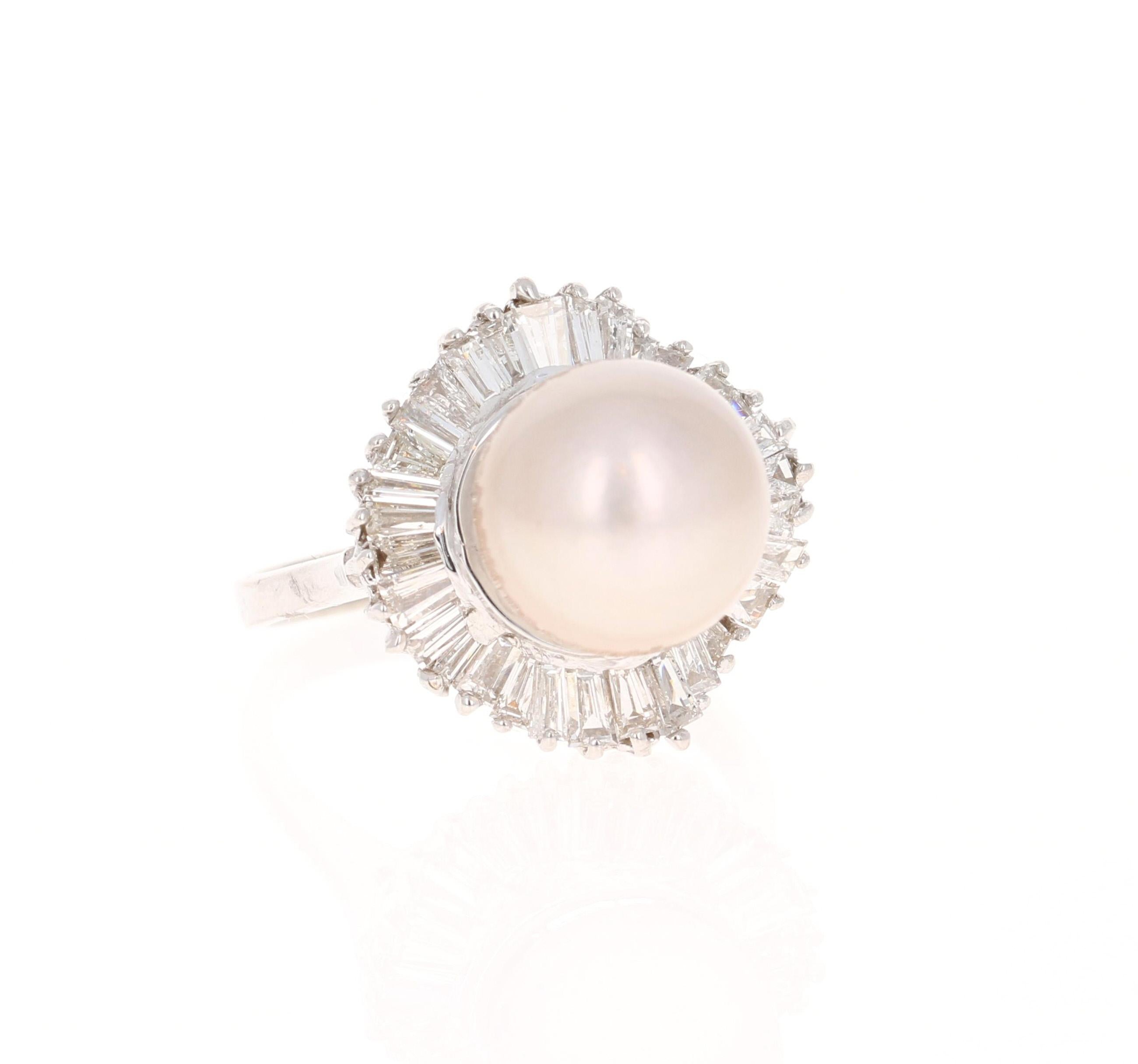 This beautiful ring has a stunning 10 mm South Sea Pearl that is set in the center of the ring.  The pearl is surrounded by a cluster of 34 Baguette Cut Diamonds that weigh 1.50 carats (Clarity: VS and Color: H) 
The ring is made in 14K White Gold
