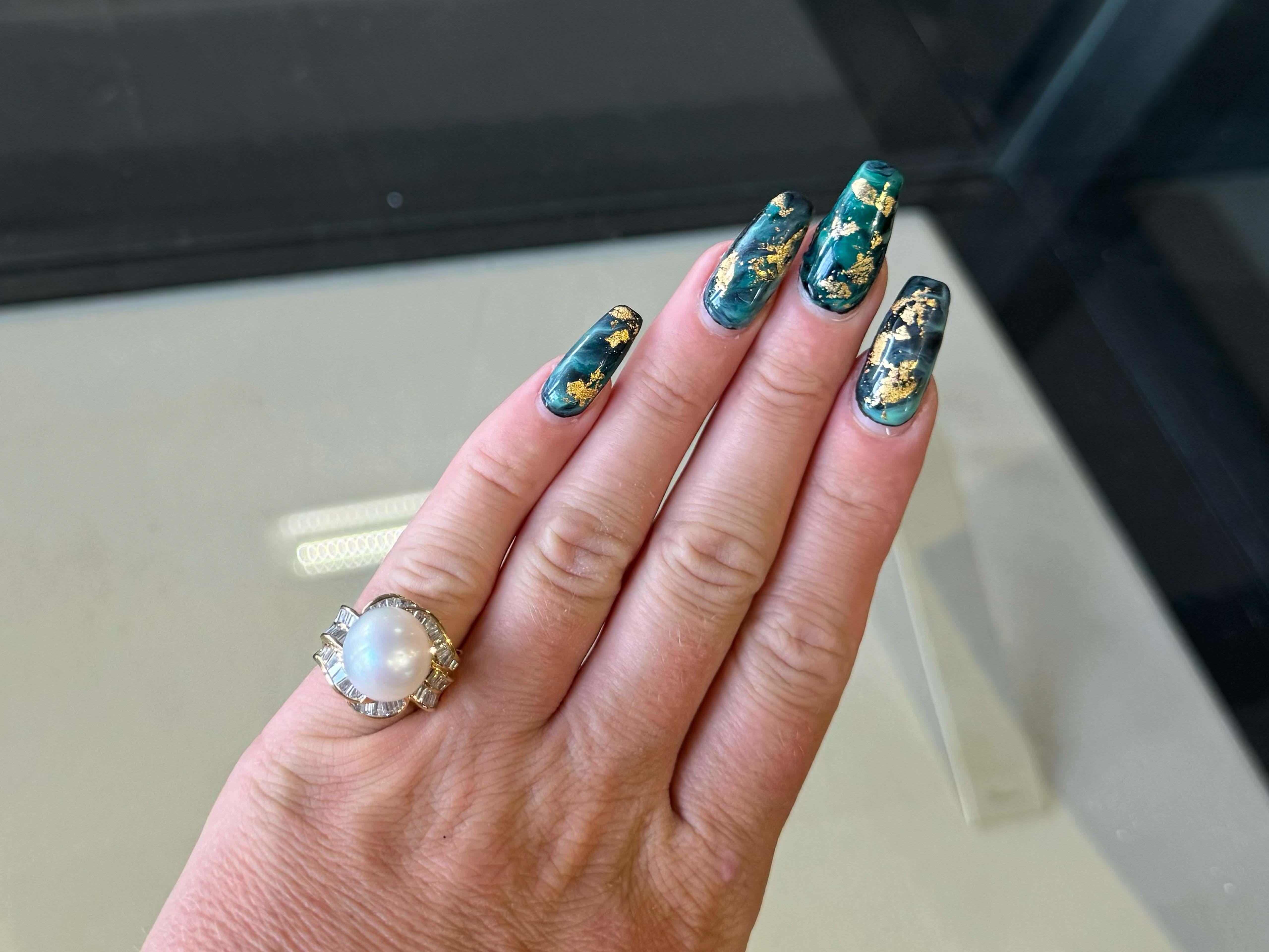Ring Specifications:

Metal: 18k Yellow Gold

Total Weight: 10.0 Grams

Pearl Diameter: ~12.5 mm

Pearl Count: 1 south sea pearl

Diamond Count: 54 baguette

Diamond Color: G-H

Diamond Clarity: SI1-I1

Diamond Carat Weight: 1.00 carats total

Ring