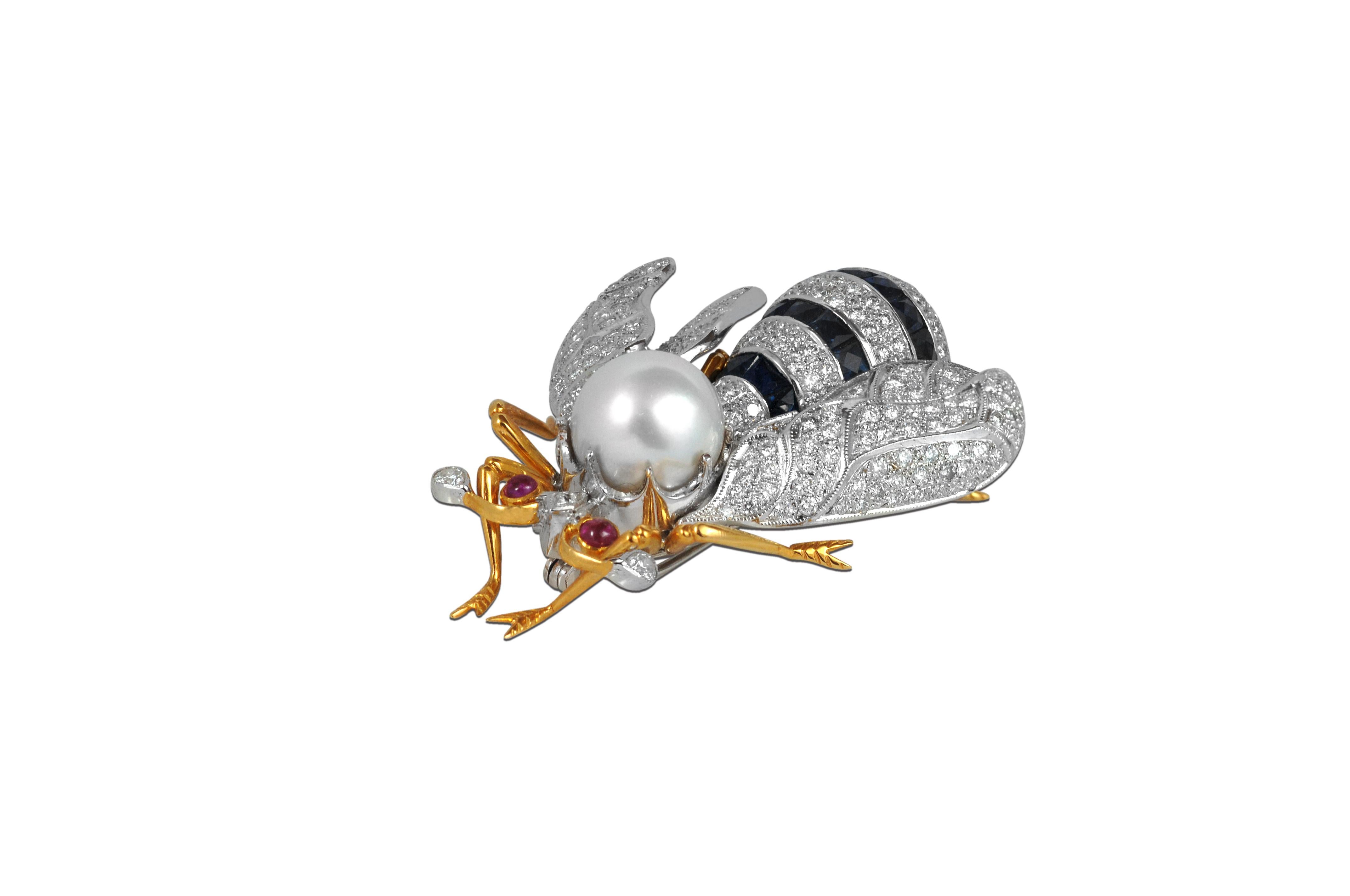 For all Bee lovers, you are staring at a South Sea Pearl, Blue Sapphire 10.96 carats, Diamond 3.44 carats with Cabuchon Ruby 0.22 carat Brooch set in 18 Karat White Gold Settings

Width: 4.3 cm
Length: 5.1 cm 


