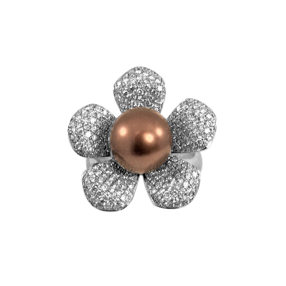 This beautiful and distinct floral pearl ring has a genuine chocolate color South Sea pearl in the center with 2.25 carat of white diamonds pavé set on its petals artfully crafted in 18 karat white gold. It is in size 7 and if needed it can be