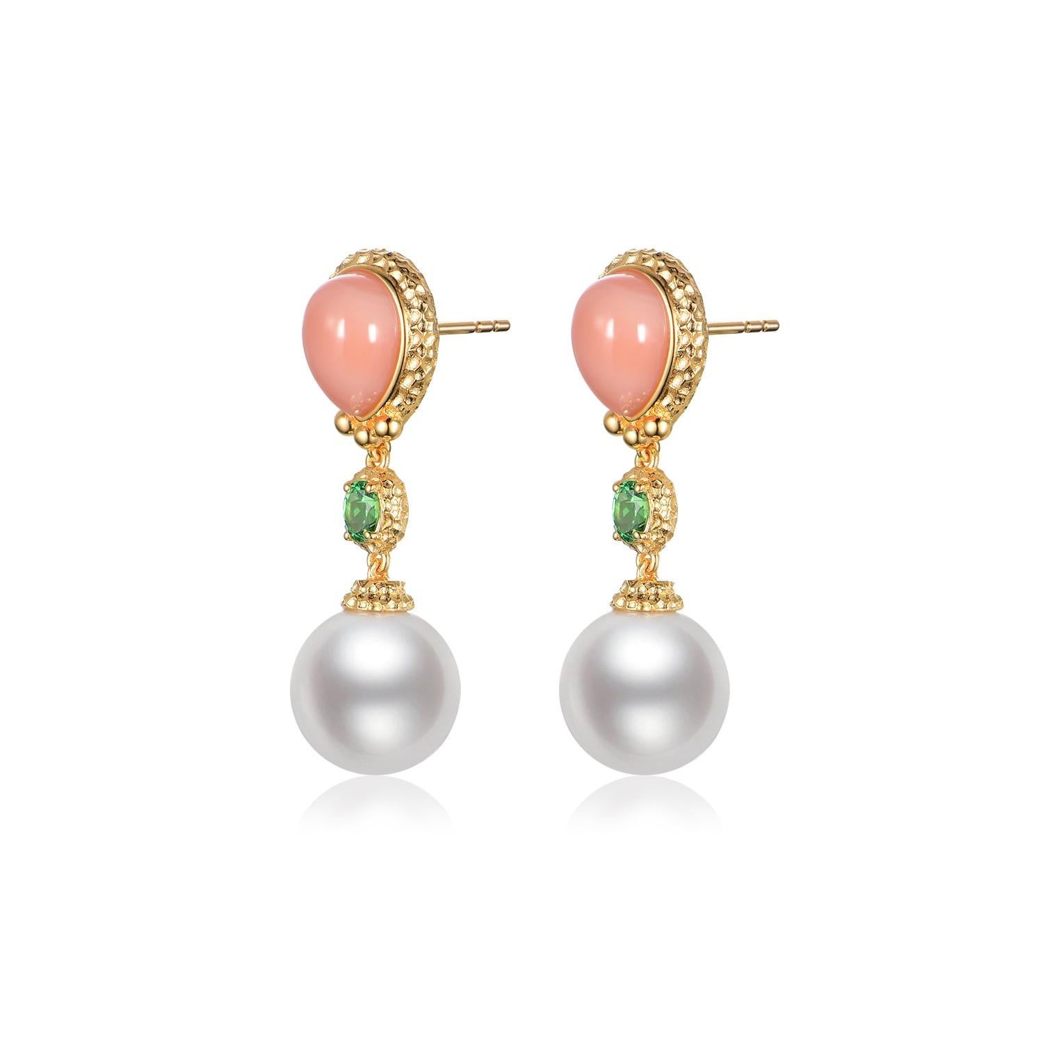 Emanate elegance with these exquisite drop earrings, featuring the natural beauty of South Sea pearls. Crafted with a lustrous 18K gold vermeil over sterling silver, each earring showcases a smooth, pink coral, weighing a total of 4.65 carats, set