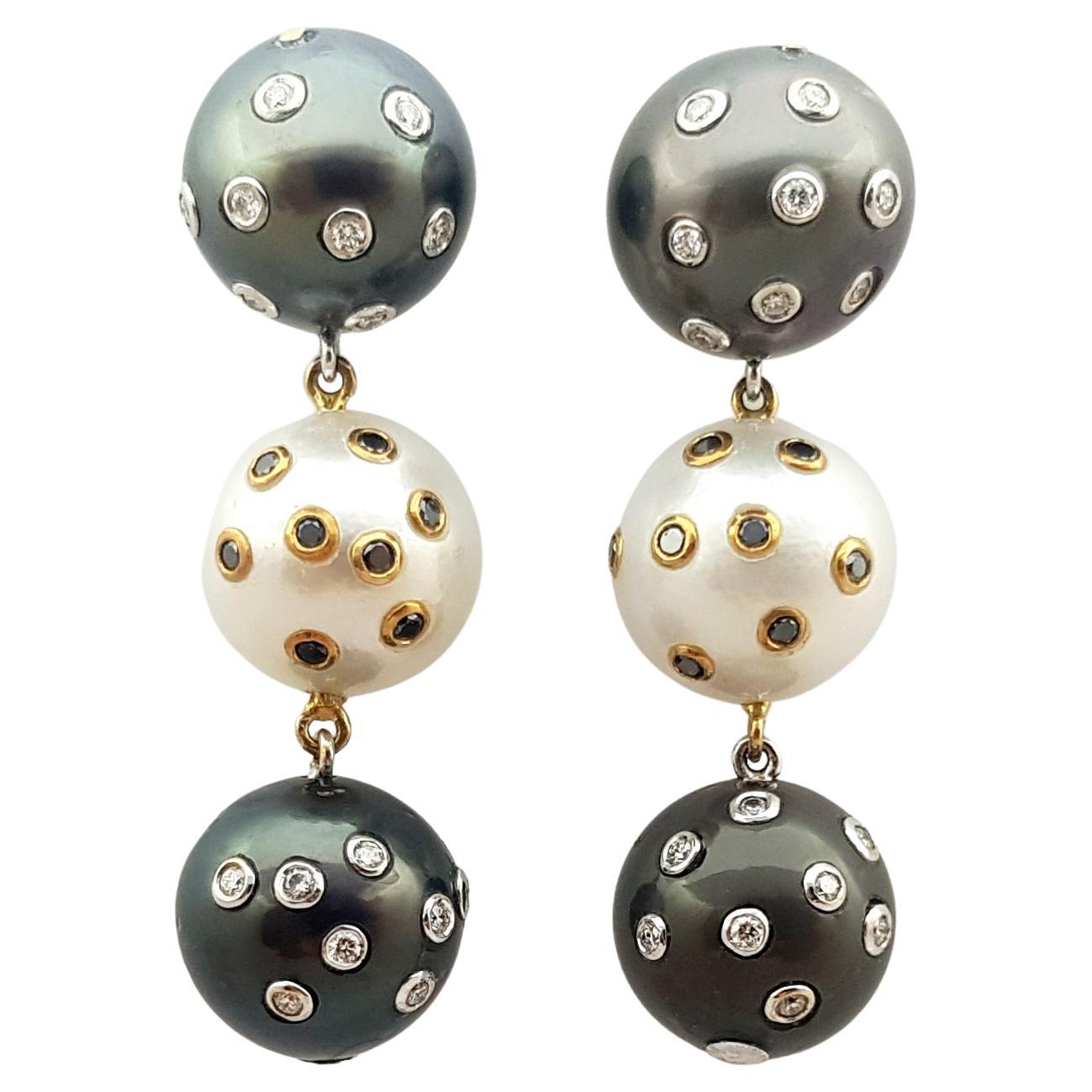 South Sea Pearl, Diamond and Black Diamond Earrings Set in 18k Gold Settings For Sale
