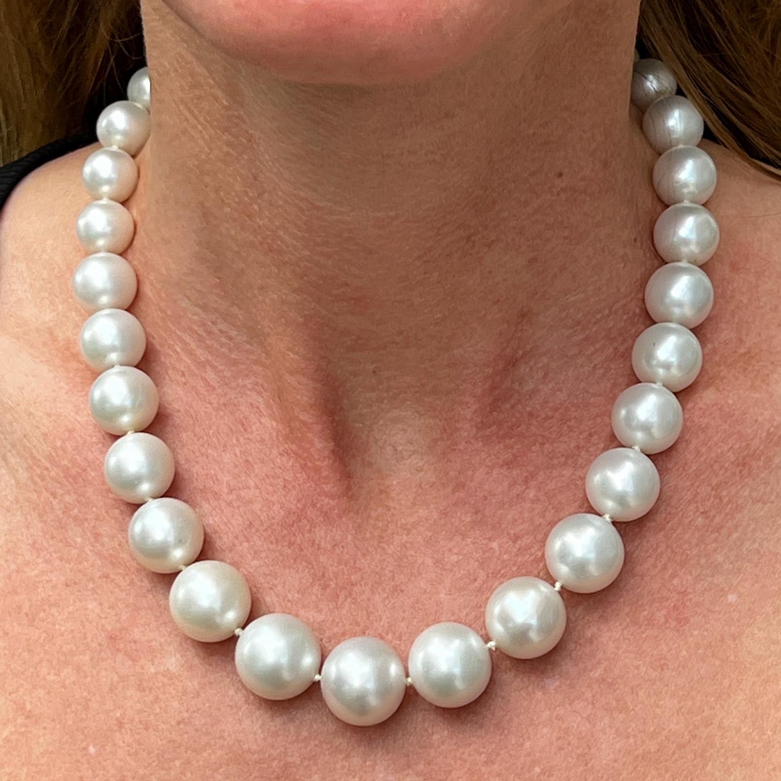 Beautiful and elegant South Sea Pearl necklaice with a diamond ball clasp. The 31 graduated and beautifully matched South Sea pearls measure 10.7-15.8mm in diameter and the necklace 17 inches in length. The 18 karat white gold diamond clasp is set
