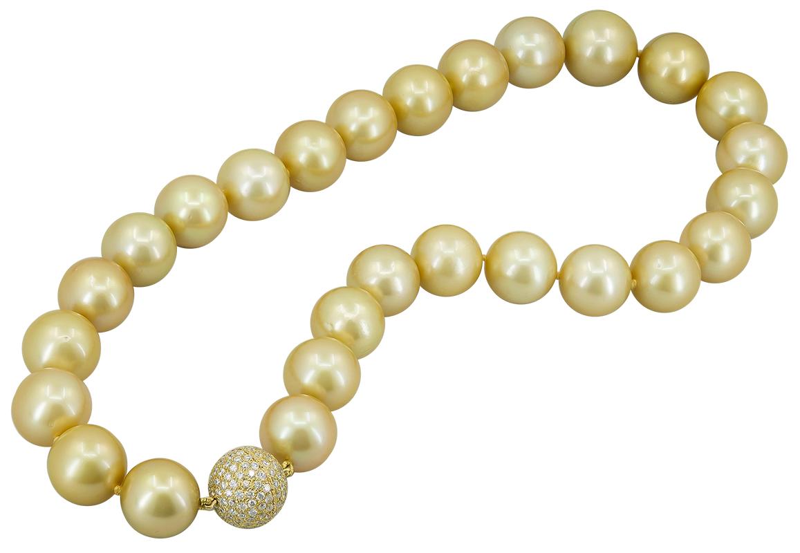 South Sea Pearl Diamond Bead Necklace in 18k Yellow Gold.
A classic vintage princess-length pearl necklace comprised of 27 golden cultured pearls with a bead of white diamond pavé that doubles as a clasp. Pearls are above average size for the South