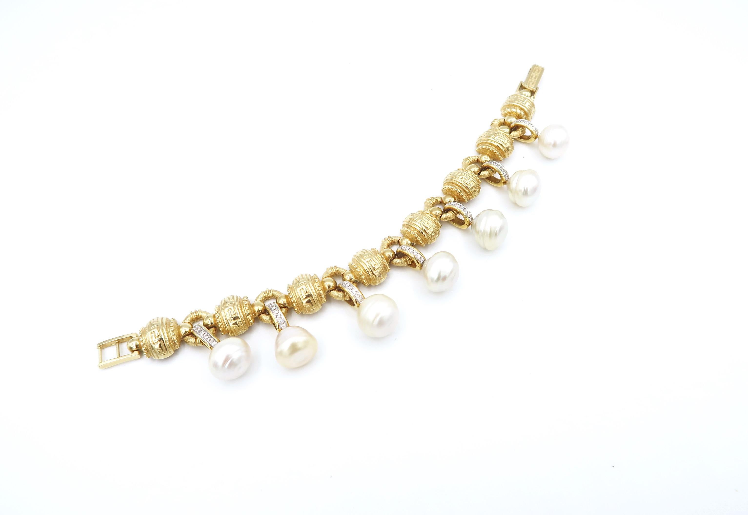 Meander Pattern/ Greek Fret/ Key Bracelet in 18K Gold with Detachable Diamond and South Sea Pearl Charm

Length: 7.5