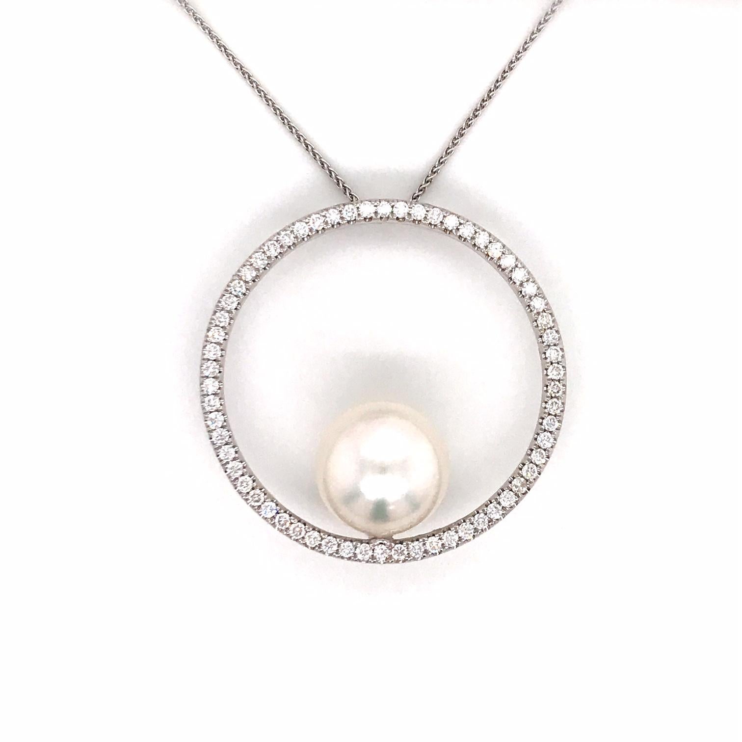 18K White gold pendant featuring one South Sea Pearl measuring 13-14 mm with a diamond circle containing 62 round brilliants weighing 1.04 carats. 
Color G-H
Clarity SI

Pearl can be changed to a Pink, Golden or Tahitian Pearl upon request. Price
