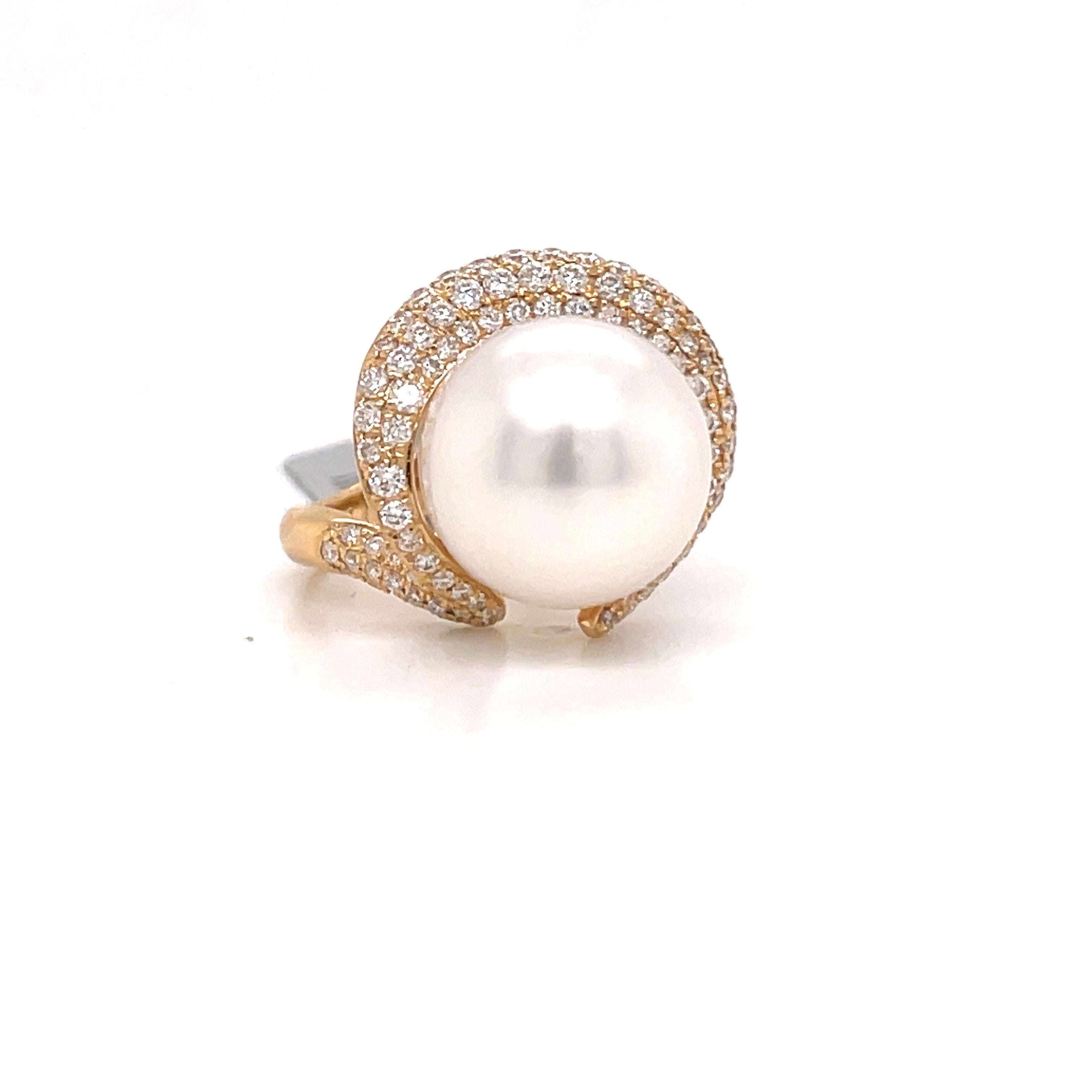 18 Karat Yellow gold ring featuring one South Sea Pearl measuring 13-14 MM flanked with 99 round brilliants weighing 0.84 carats.
Color G-H
Clarity SI
4.9 Grams
Nice Luster & Narce AA