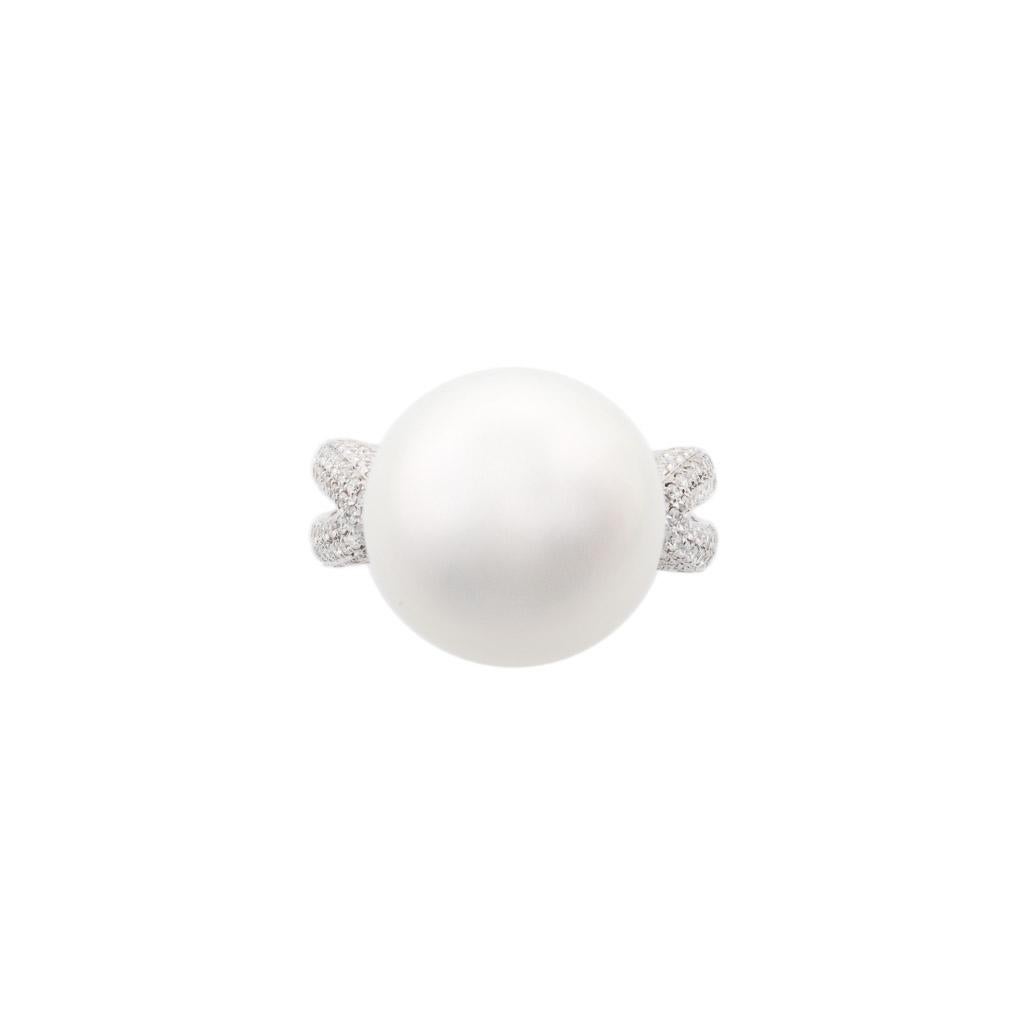 Fine Australian South Sea pearl and diamond ring.
Perfectly round and unblemished with a beautiful lustre set in 18ct white gold and encrusted with pave set diamonds. 
The most revered and highly prized pearls in the world. The Australian South Sea
