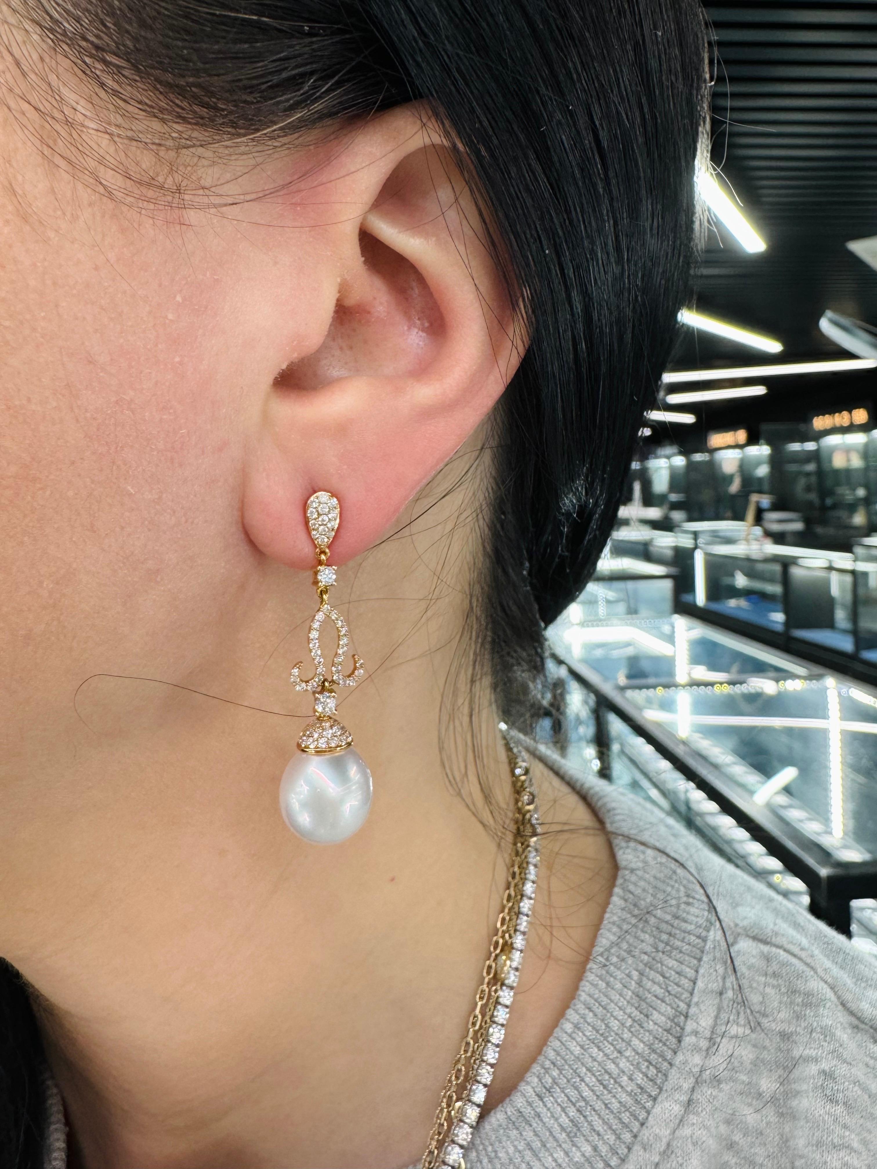 18 Karat rose gold dangle drop earrings featuring 120 round brilliants weighing 1.04 carats and two South Sea Pearls measuring 11-12 MM.

Pearl Size	11-12mm
Nature	South Sea Cultured Pearl
Pearl Quality	AA
Luster	AA, Excellent
Nacre	Very