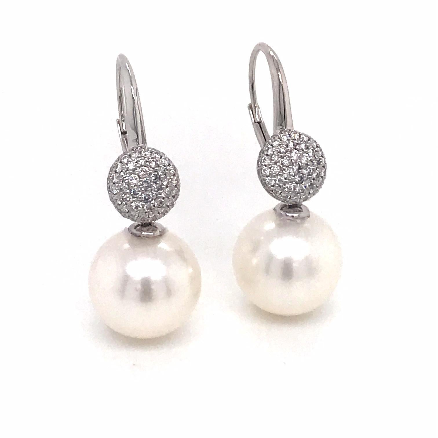 18K White gold drop earrings featuring two South Sea pearls measuring 12-13 mm with 114 round brilliants weighing 0.47 carats.
Color G-H
Clarity SI

Pearl can be changed to a Pink, Golden or Tahitian Pearl upon request. Price subject to