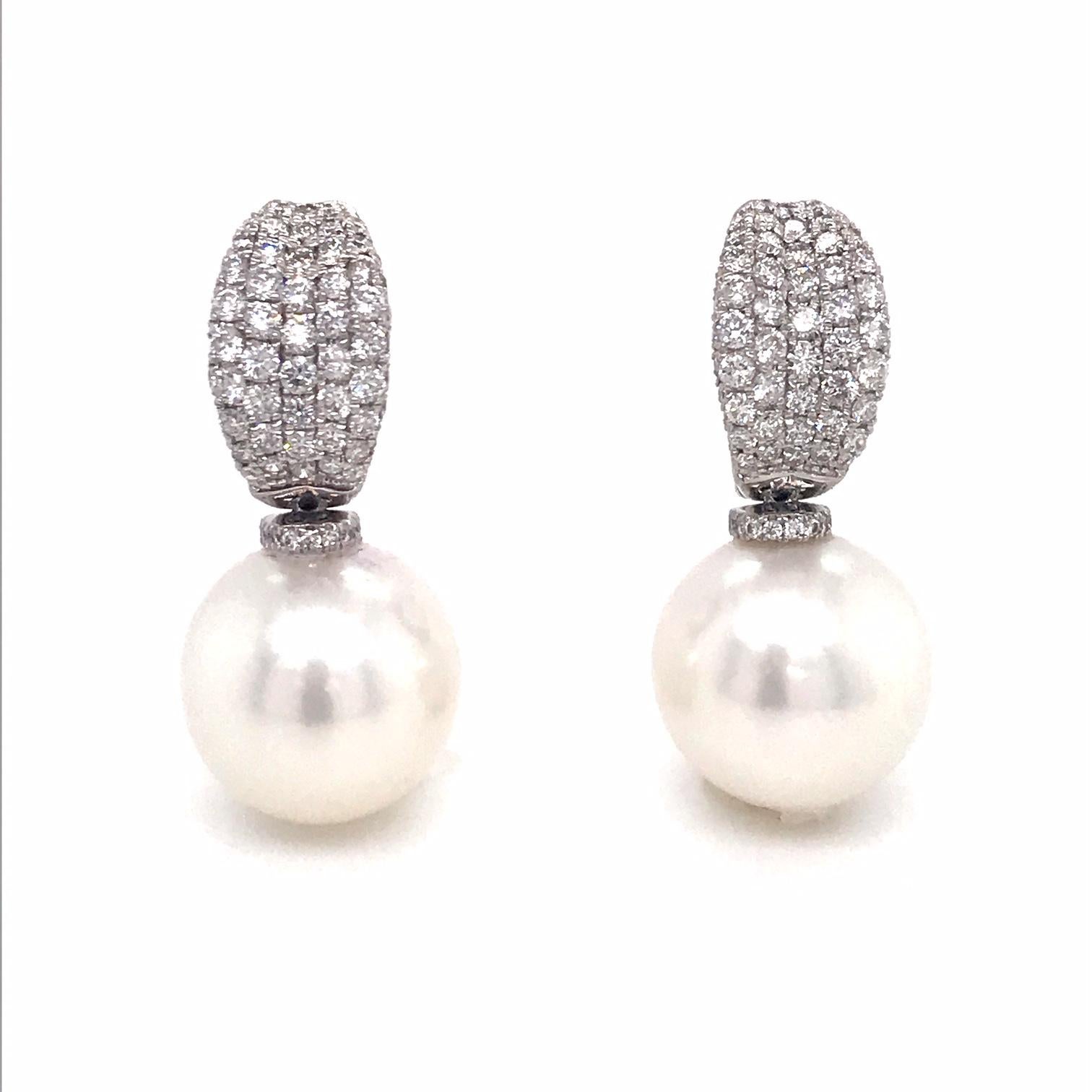 18K White gold drop earrings featuring two South Sea Pearls measuring 12-13 mm with a diamond top containing 148 round brilliants weighing 1.12 carats.
Color G-H
Clarity SI

Pearls can be changed to Tahitian, Pink or Golden Pearls upon request.