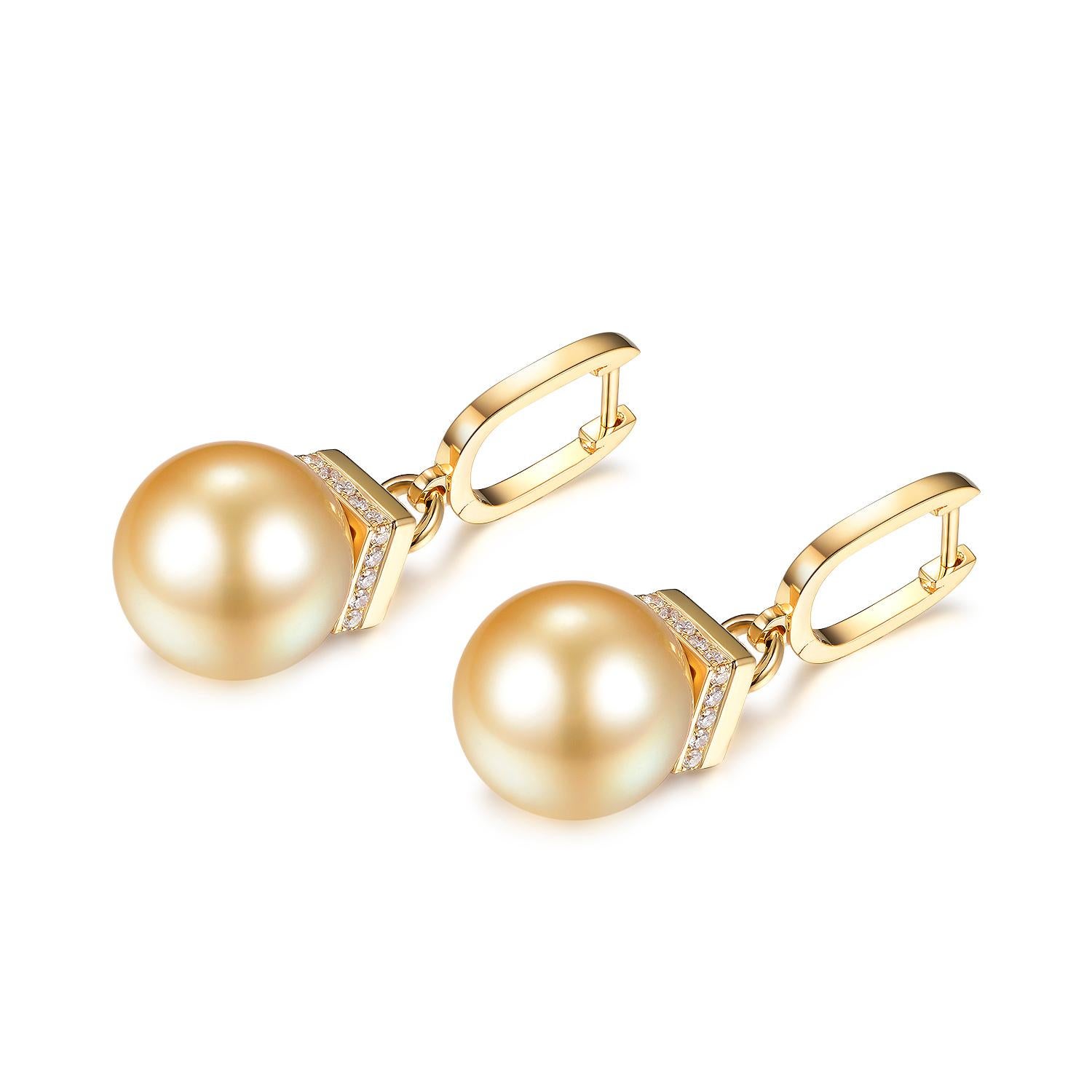 These exquisite South Sea Pearl Diamond Drop Earrings in 18 Karat Yellow Gold are a luxurious addition to any fine jewelry collection. The South Sea pearls, renowned for their size and luster, are the stars of this elegant design. Weighing in at