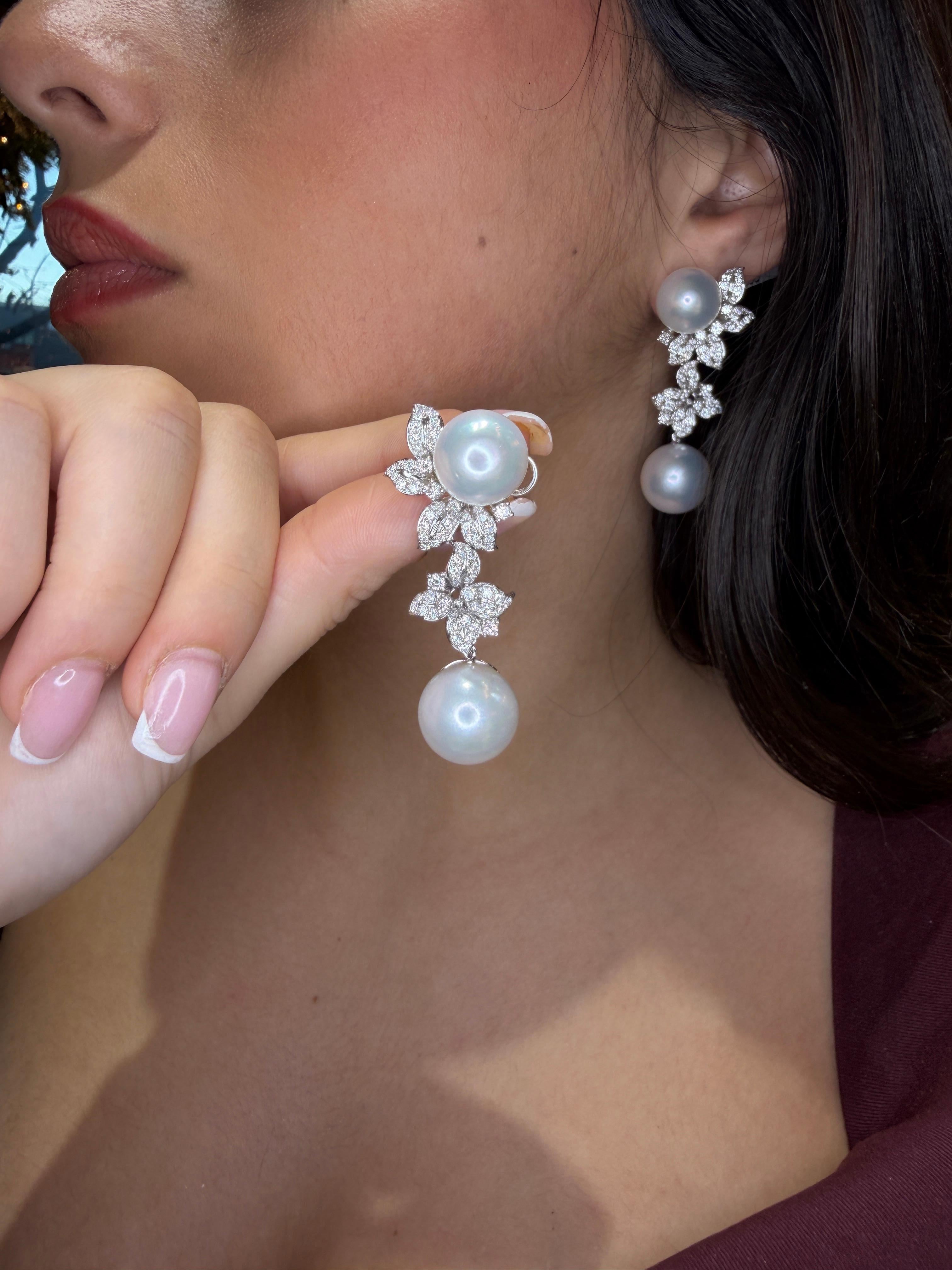 A luxurious pair of South Sea pearl and diamond floral earrings, masterfully crafted in solid 18K white gold and designed with the refined three-dimensional artistry seen in high jewelry designer houses. These exceptional earrings feature four