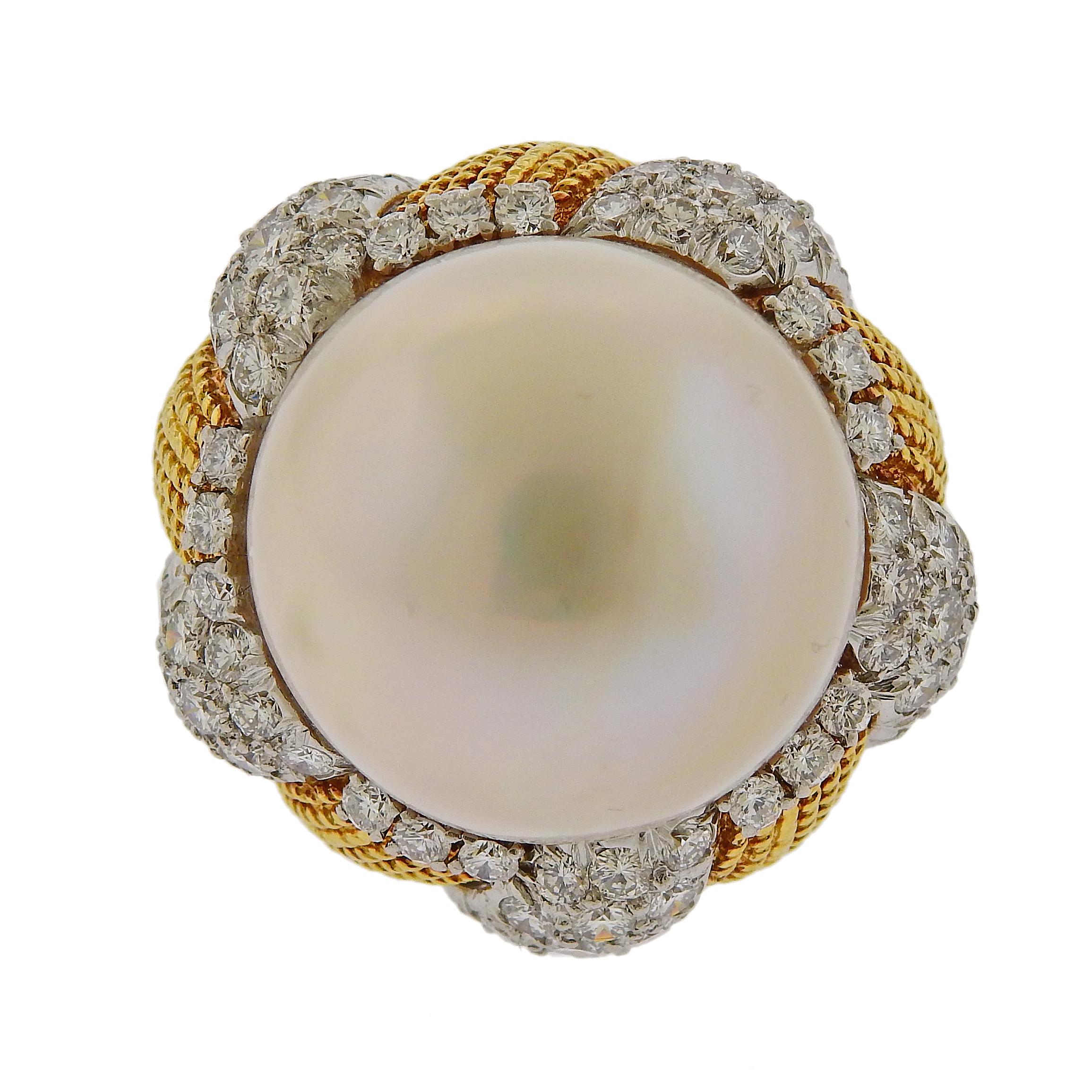 large 18k gold cocktail ring, set with a 20.2mm South Sea pearl, approx. 2.75ctw in diamonds. Ring size 5.5, ring top is 26mm x 28mm. Marked 750. Weighs 30.5 grams. 

SKU#R-03062