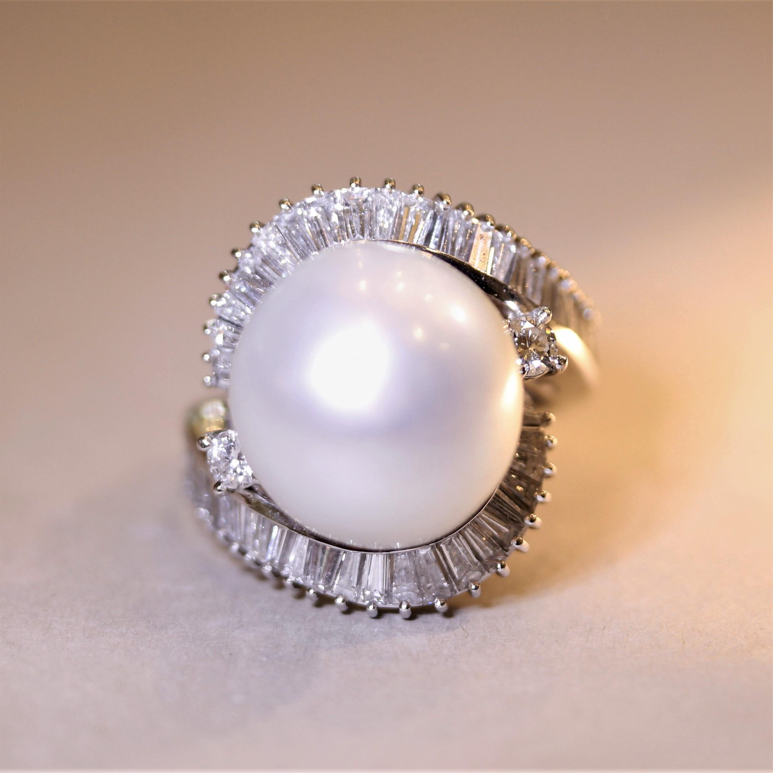A large and impressive South Sea pearl! It measures 15.5 millimeters and has excellent luster with a soft pink overtone. It is accented by 2.50 carats of round brilliant-cut and baguette-cut diamonds which are set around the pearl in a spiraling