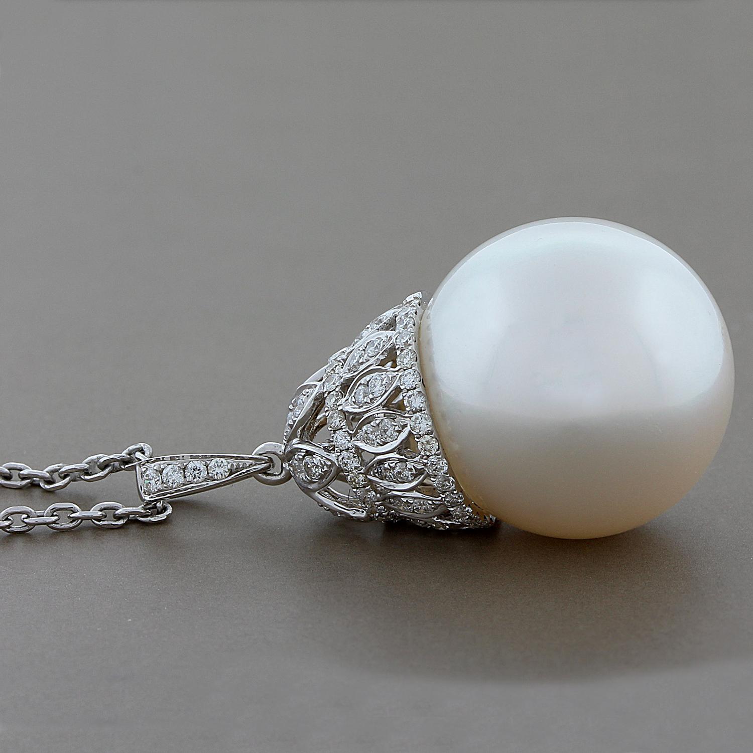 This feminine pendant features a lustrous 16.5 mm South Sea pearl with 0.40 carats of VS clarity round diamonds.  The pearl is lustrous and uniform in surface color all around.  A royal design set in 18K white gold. 

Chain Length: 18